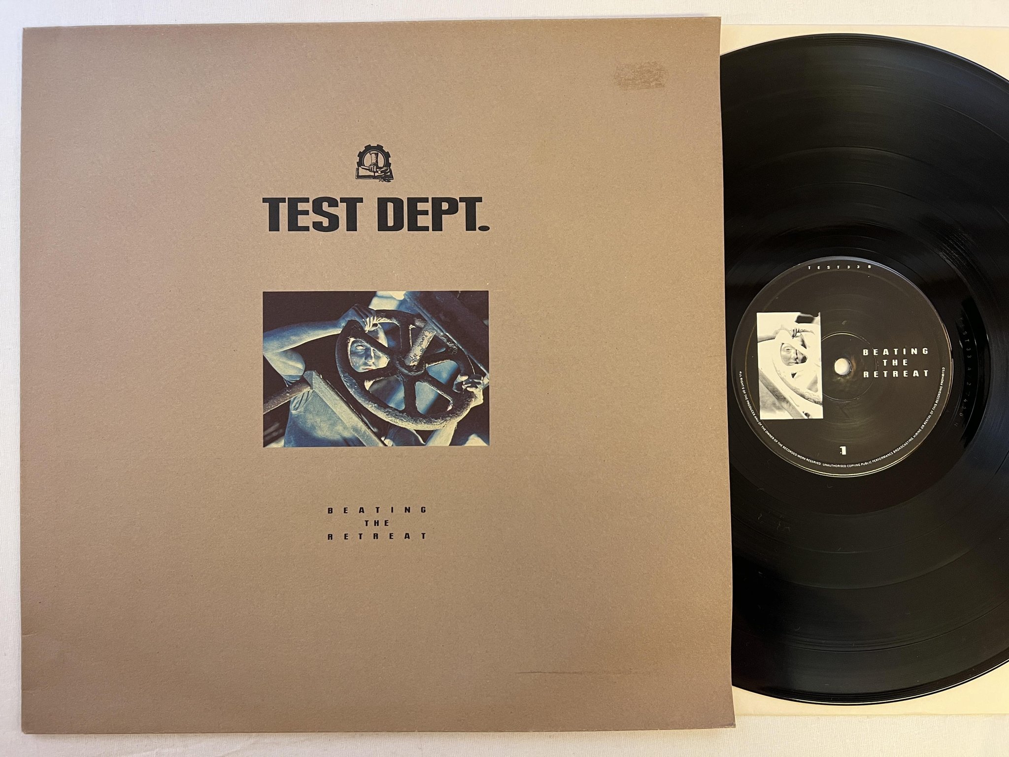 Omslagsbild för skivan TEST DEPT. Beating The Retreat LP -87 MERCURY TEST33