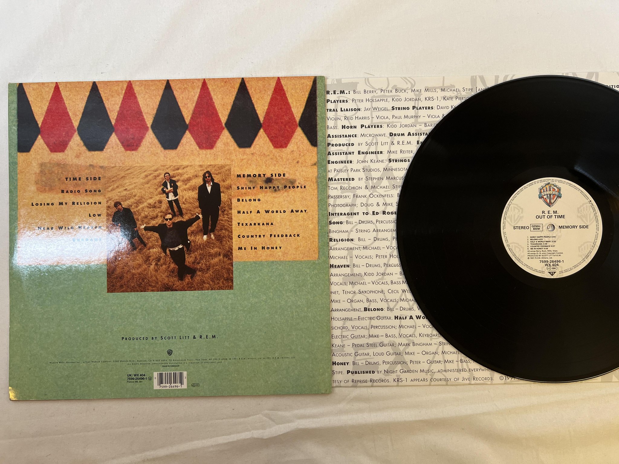 Omslagsbild för skivan R.E.M. Out Of Time LP -91 warner bros 7599-26496-1