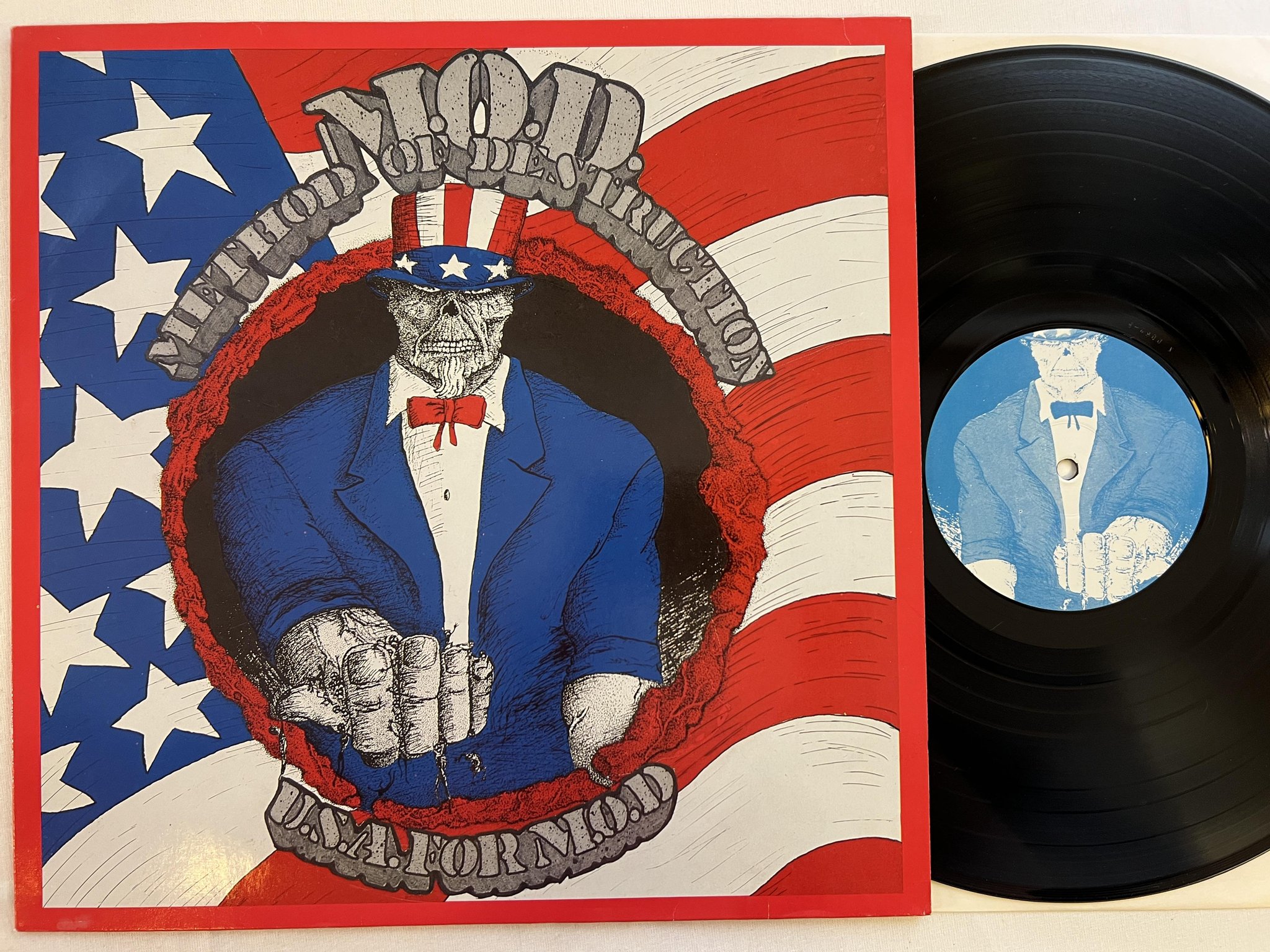 Omslagsbild för skivan M.O.D.  U.S.A. For M.O.D. LP -87 Ger NOISE INTERNATIONAL N 0089 trash