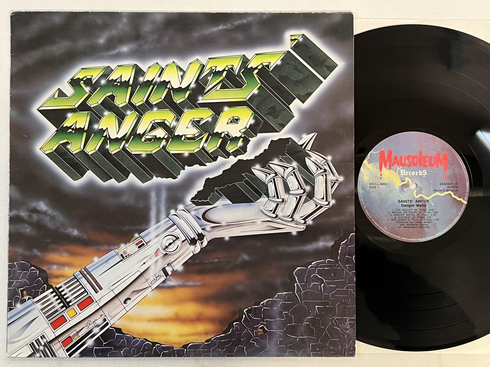 Omslagsbild för skivan SAINTS ANGER danger metal LP -85 BELGIUM MAUSOLEUM SKULL 8363