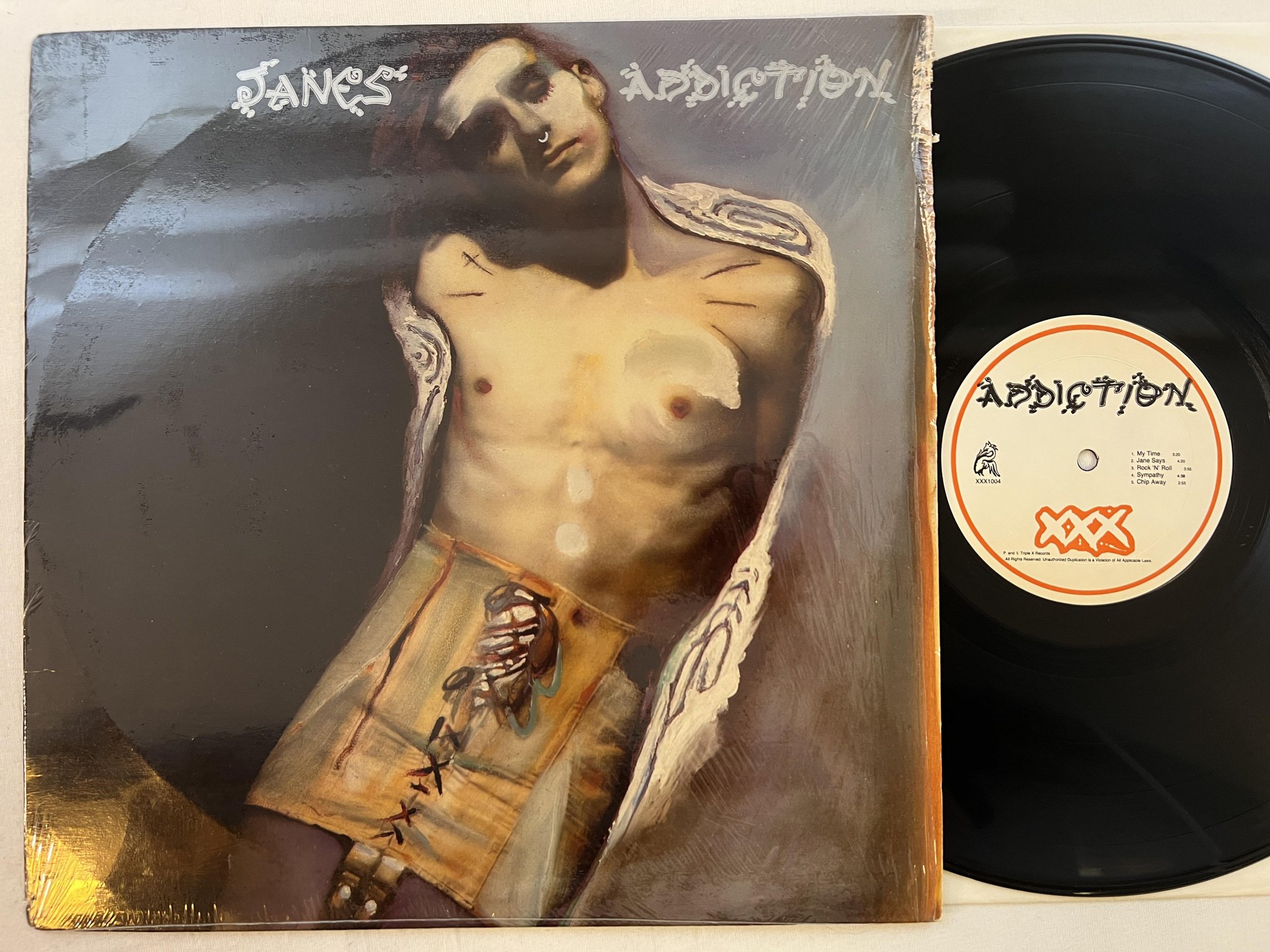 Omslagsbild för skivan JANE'S ADDICTION s/t LP -87 US TRIPLE X XXX1004