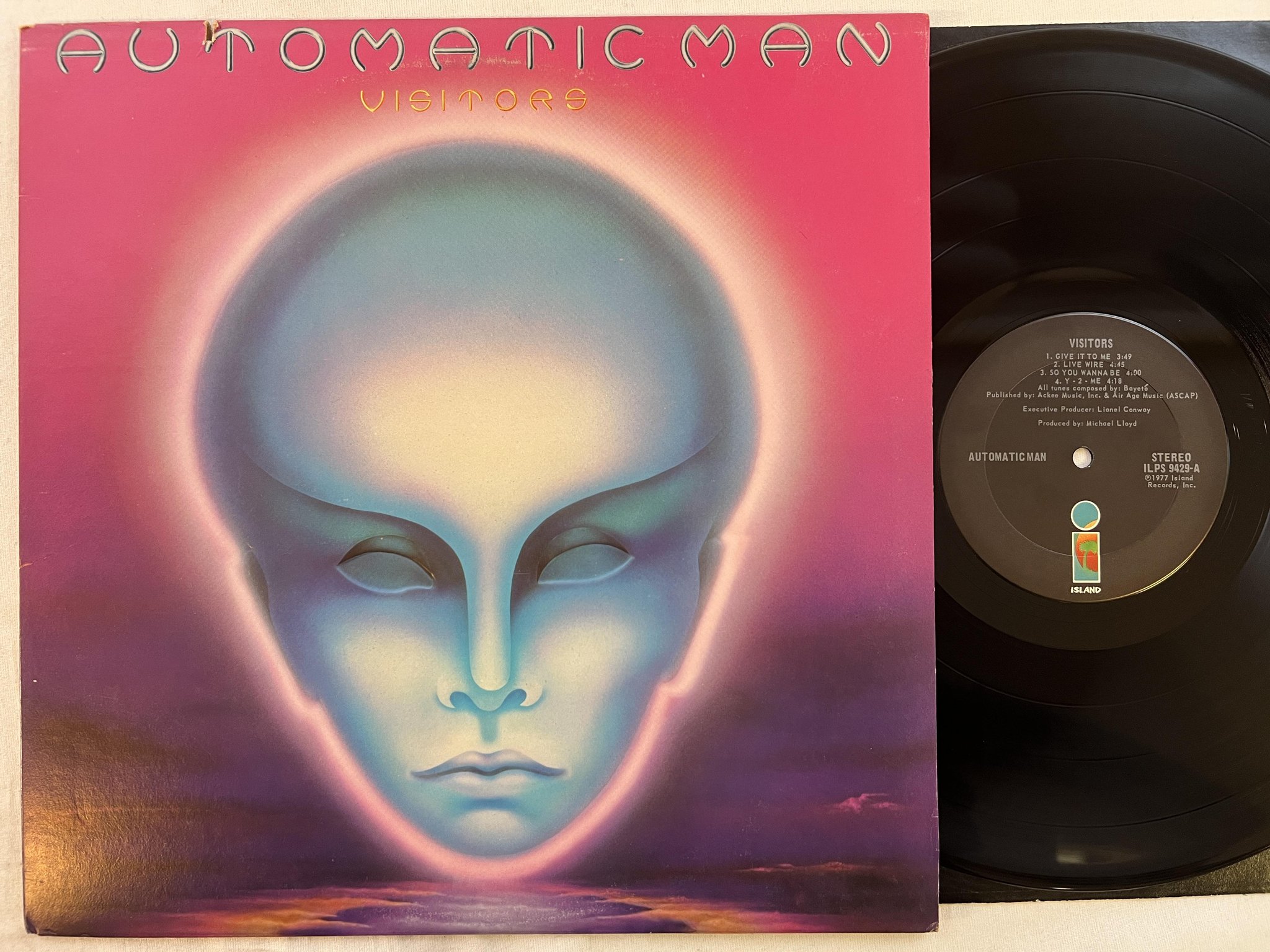 Omslagsbild för skivan AUTOMATIC MAN visitors LP -77 US ISLAND ILPS 9429