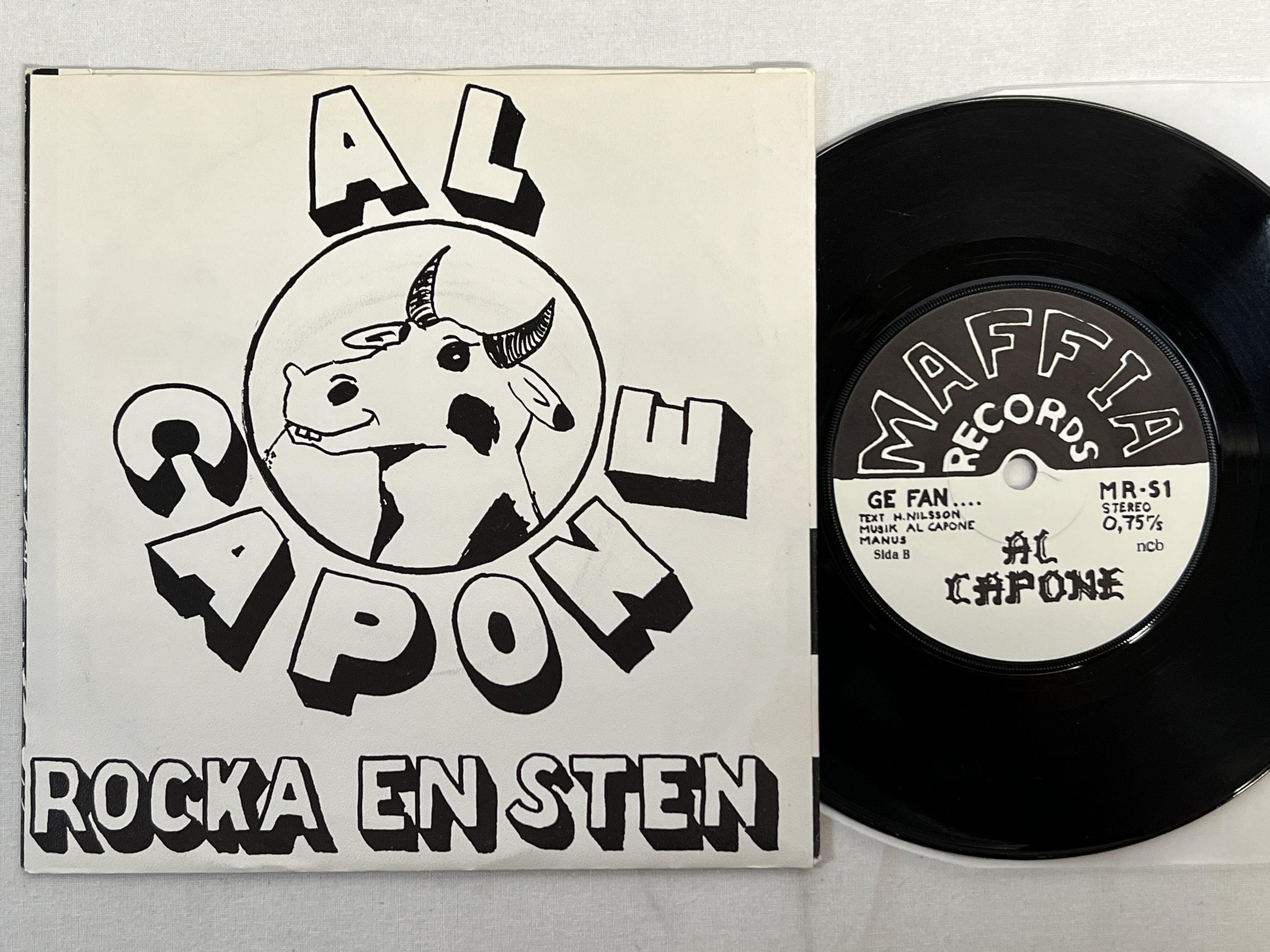 Omslagsbild för skivan AL CAPONE rocka en sten 7"single -79 MAFFIA RECORDS MR-S1 punk rock