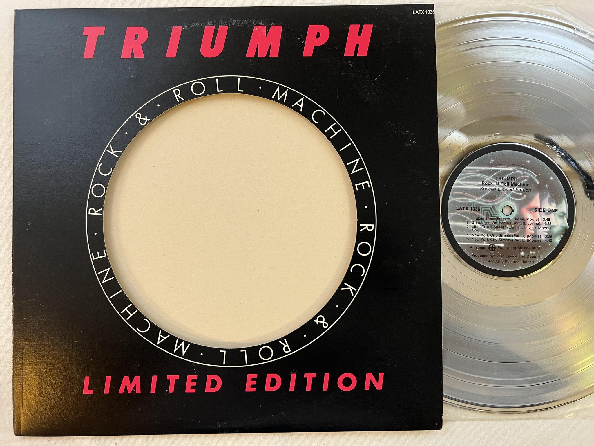 Omslagsbild för skivan TRIUMPH Rock & Roll Machine LP -77 CAN attic LATX 1036 LTD silver