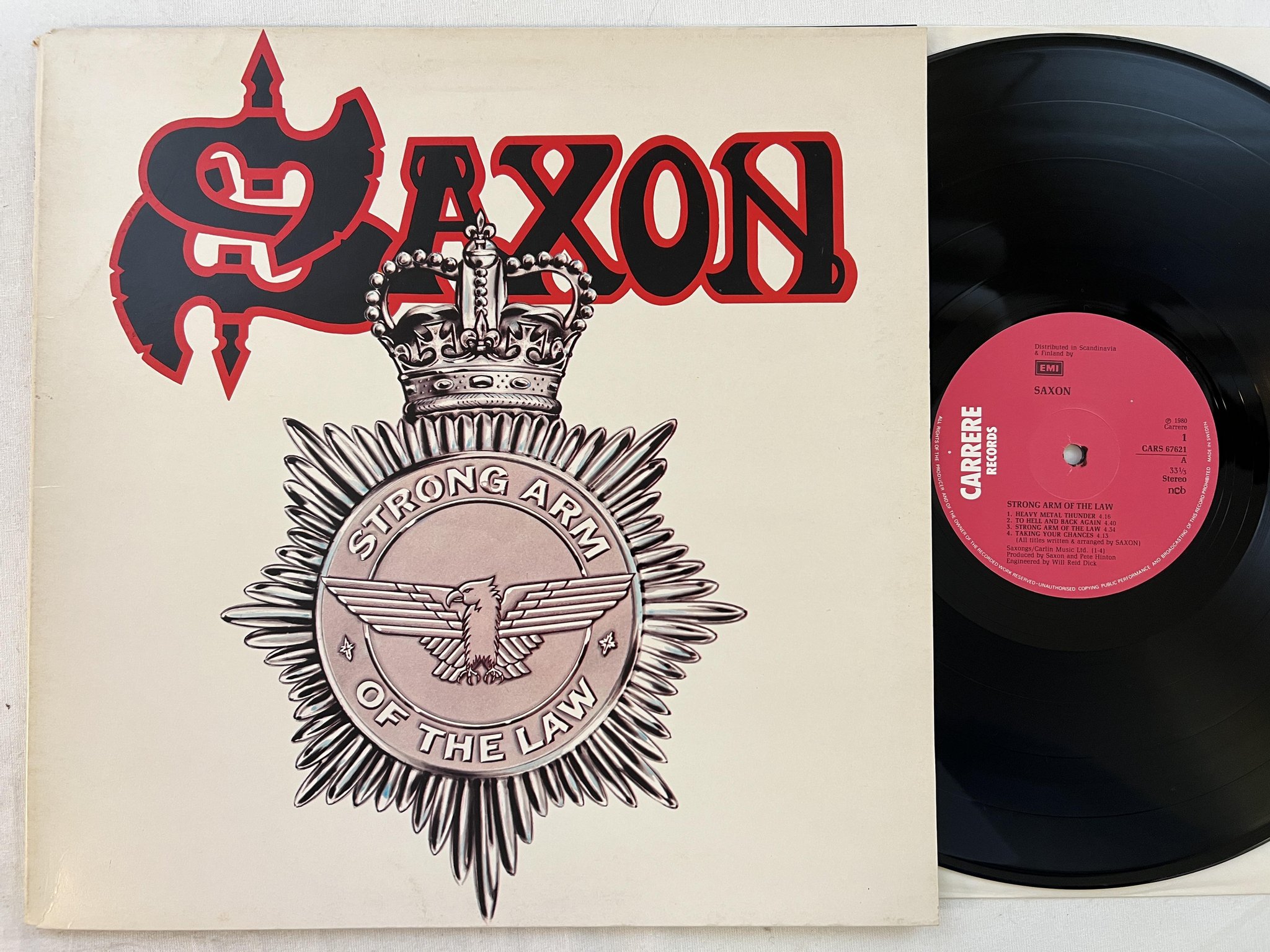 Omslagsbild för skivan SAXON strong arm of the law LP -80 ncb CARRERE CARS 67621