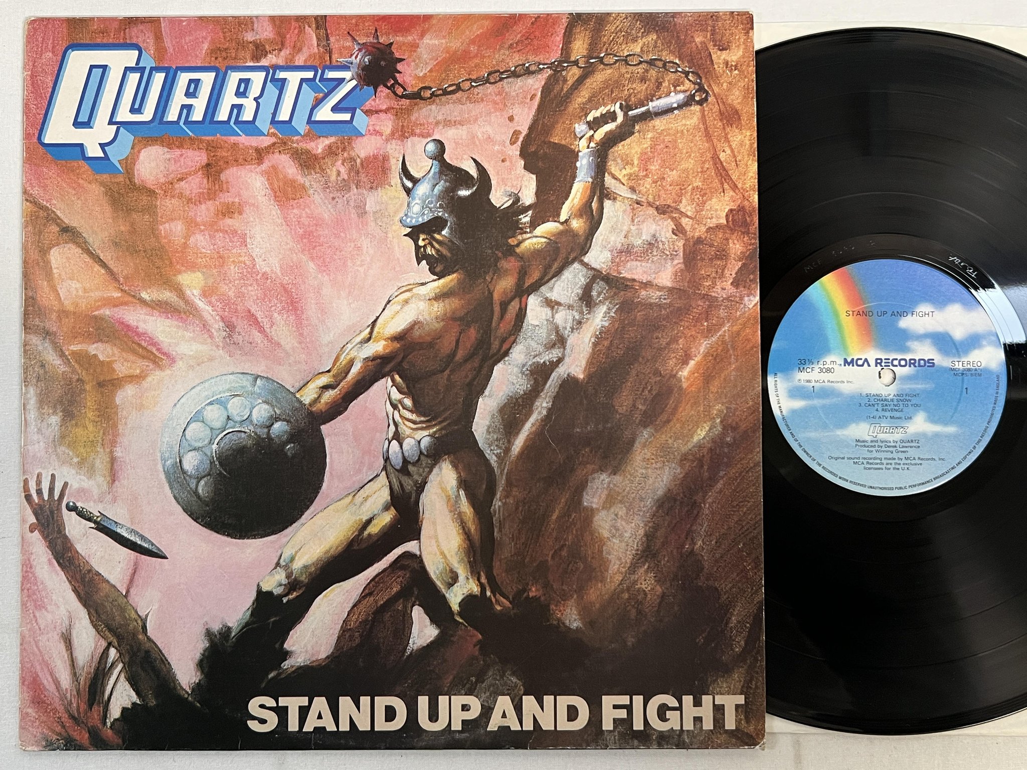 Omslagsbild för skivan QUARTZ stand up and fight LP -80 UK MCA MCF 3080