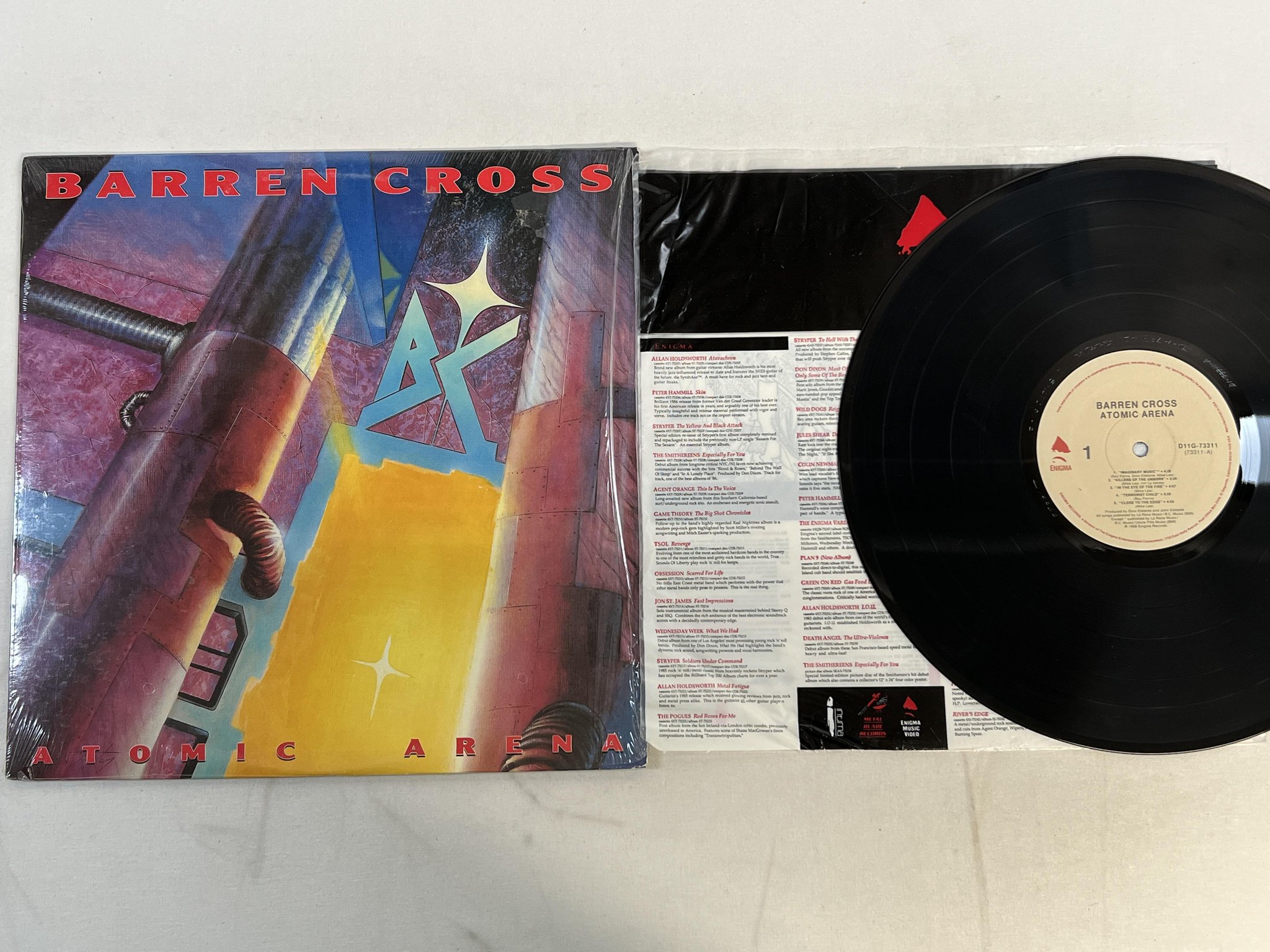 Omslagsbild för skivan BARREN CROSS Atomic Arena LP -88 Can ENIGMA D1 73311
