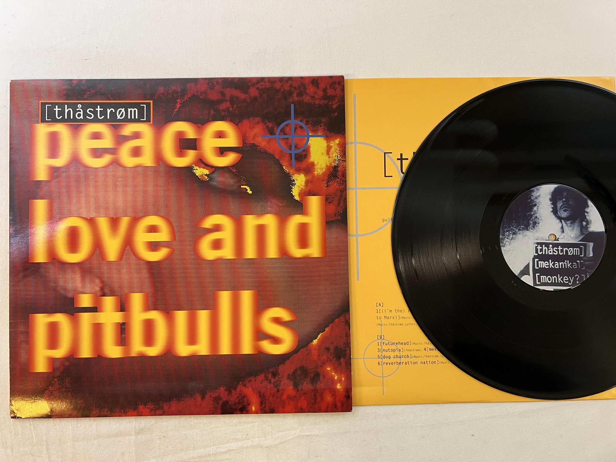 Omslagsbild för skivan PEACE LOVE AND PITBULLS s/t LP -92 Swe MVGLP 105 Thåström