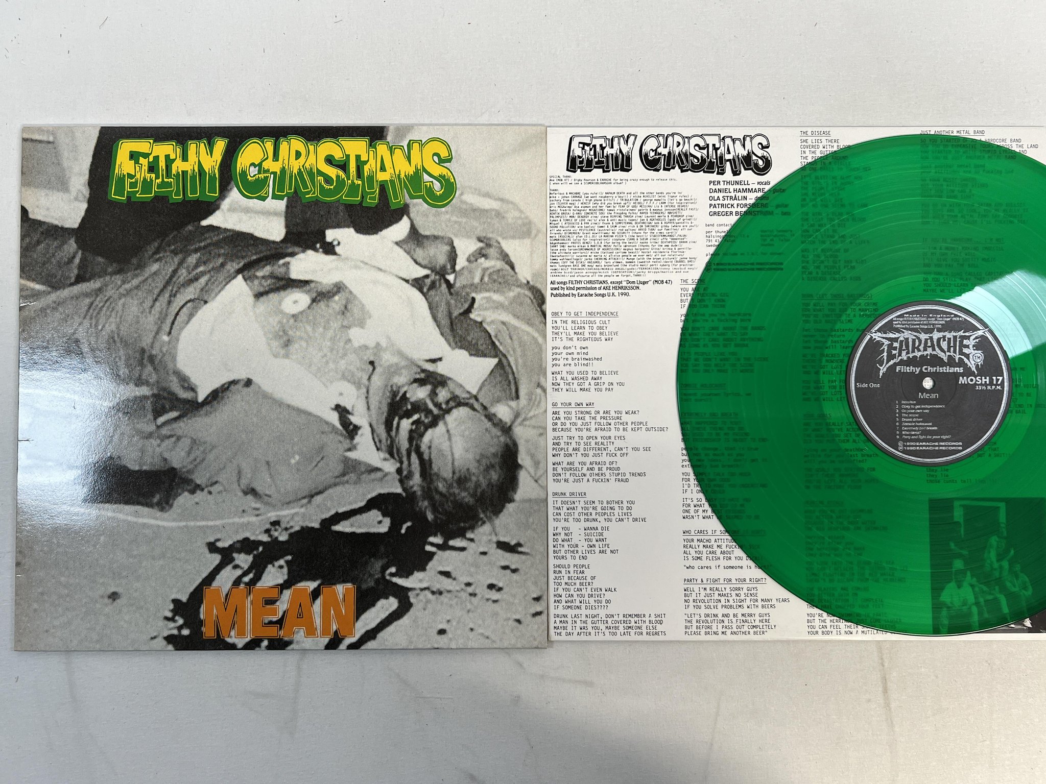 Omslagsbild för skivan FILTHY CHRISTIANS mean LP -90 Swe EARACHE MOSH 17 ** green vinyl **