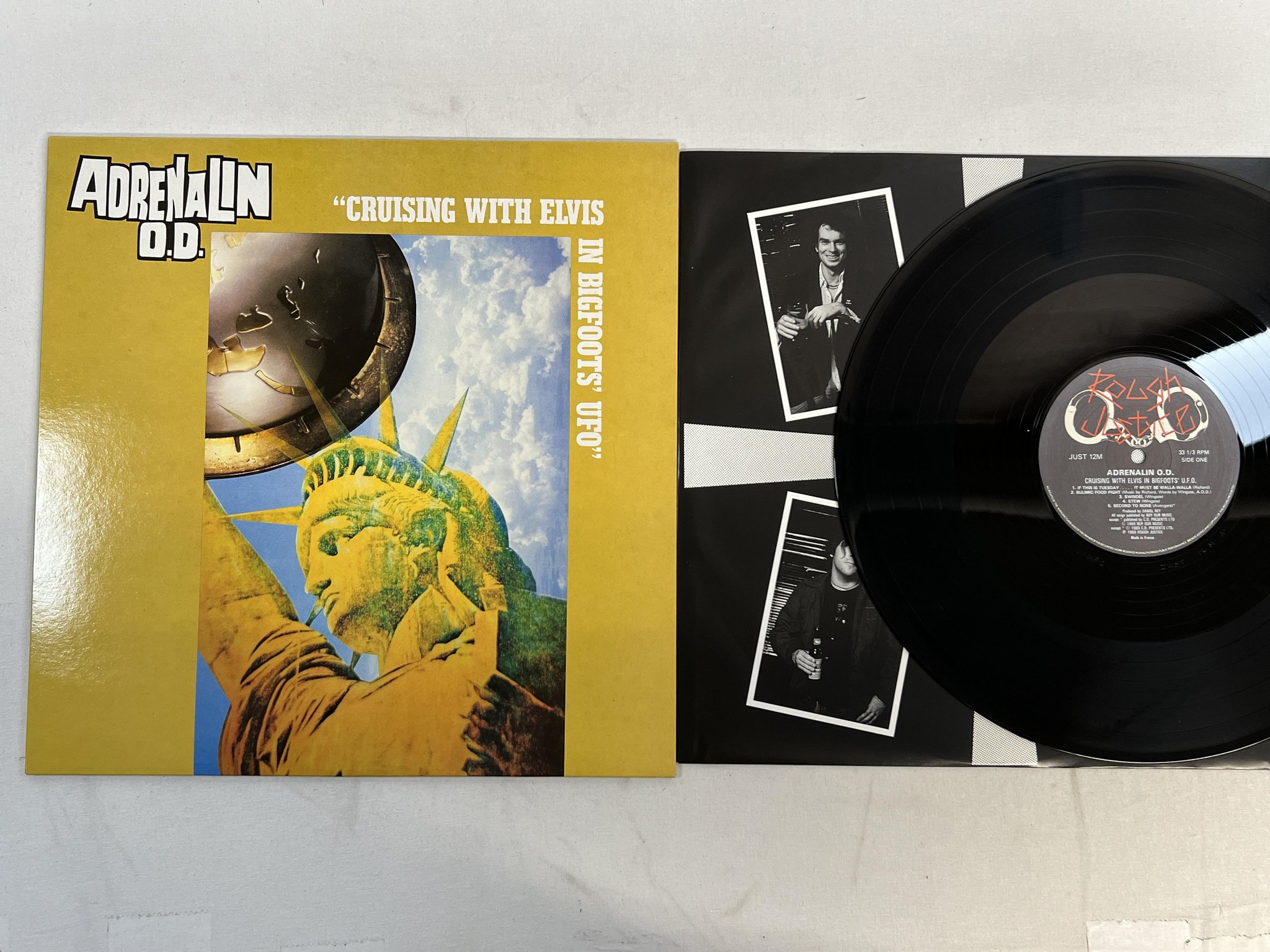 Omslagsbild för skivan ADRENALIN O.D. Cruising With Elvis In Bigfoots' U.F.O. LP -88 UK rough justice