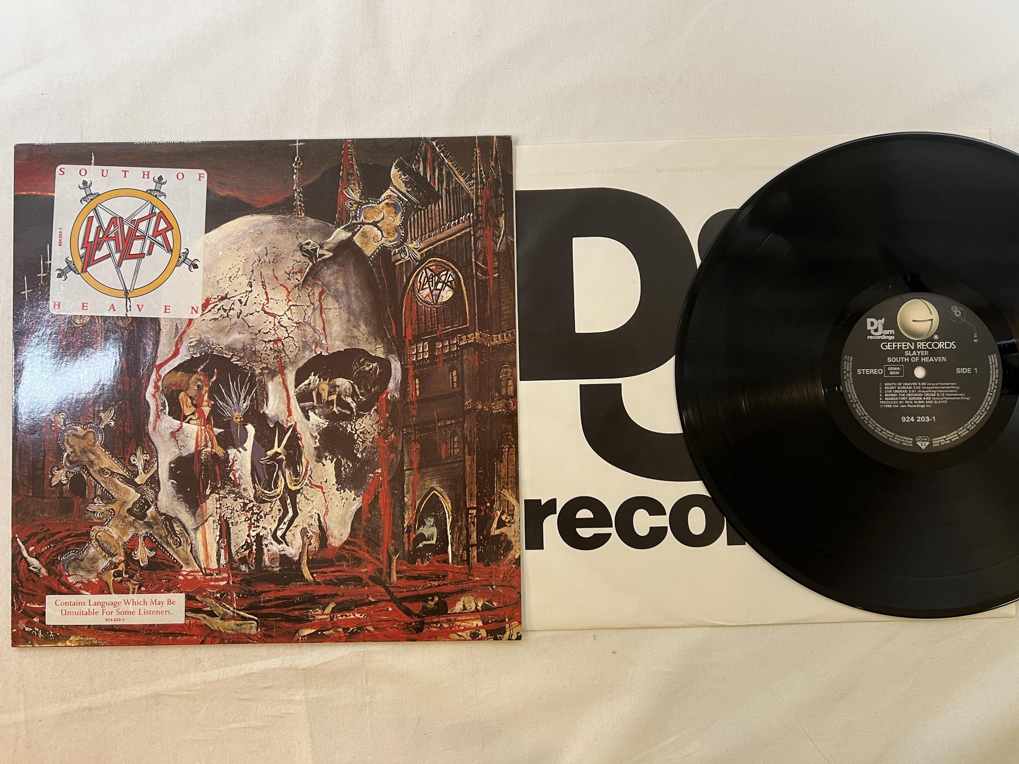 Omslagsbild för skivan SLAYER south of heaven LP -88 Ger GEFFEN 924 203-1 ** T R A S H **