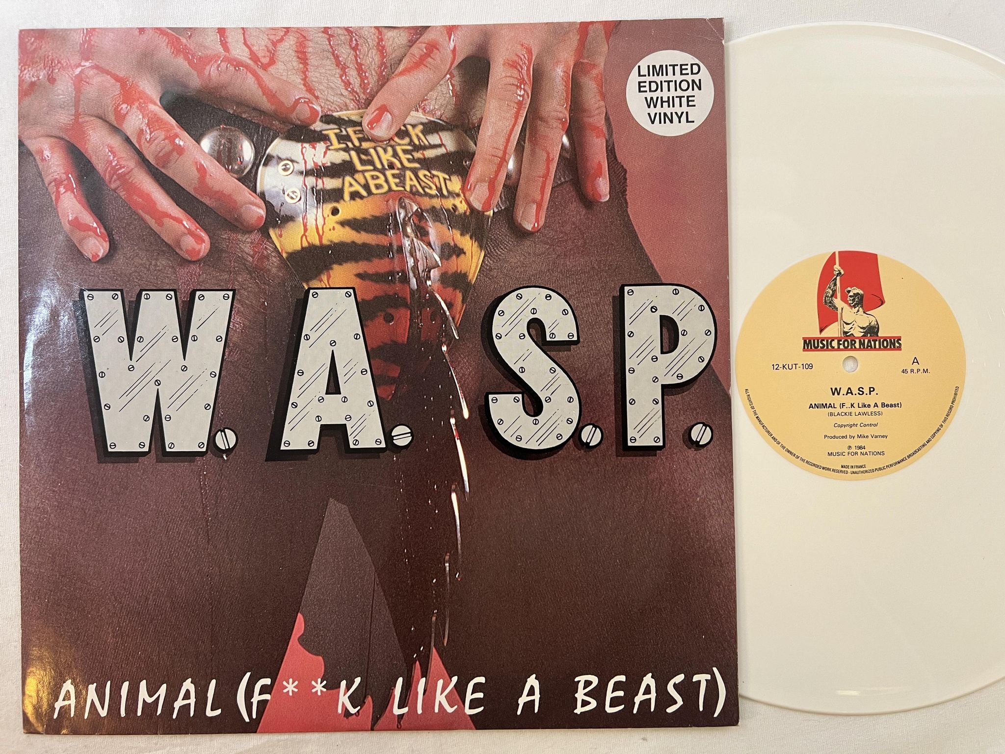 Omslagsbild för skivan W.A.S.P. animal 12"single -84 MUSIC FOR NATIONS 12-KUT-109 ** WHITE VINYL **