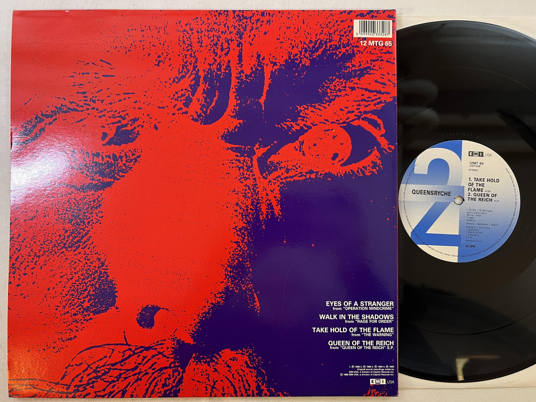 Omslagsbild för skivan QUEENSRYCHE Eyes Of A Stranger 12" -89 UK EMI USA 12 MTG 65