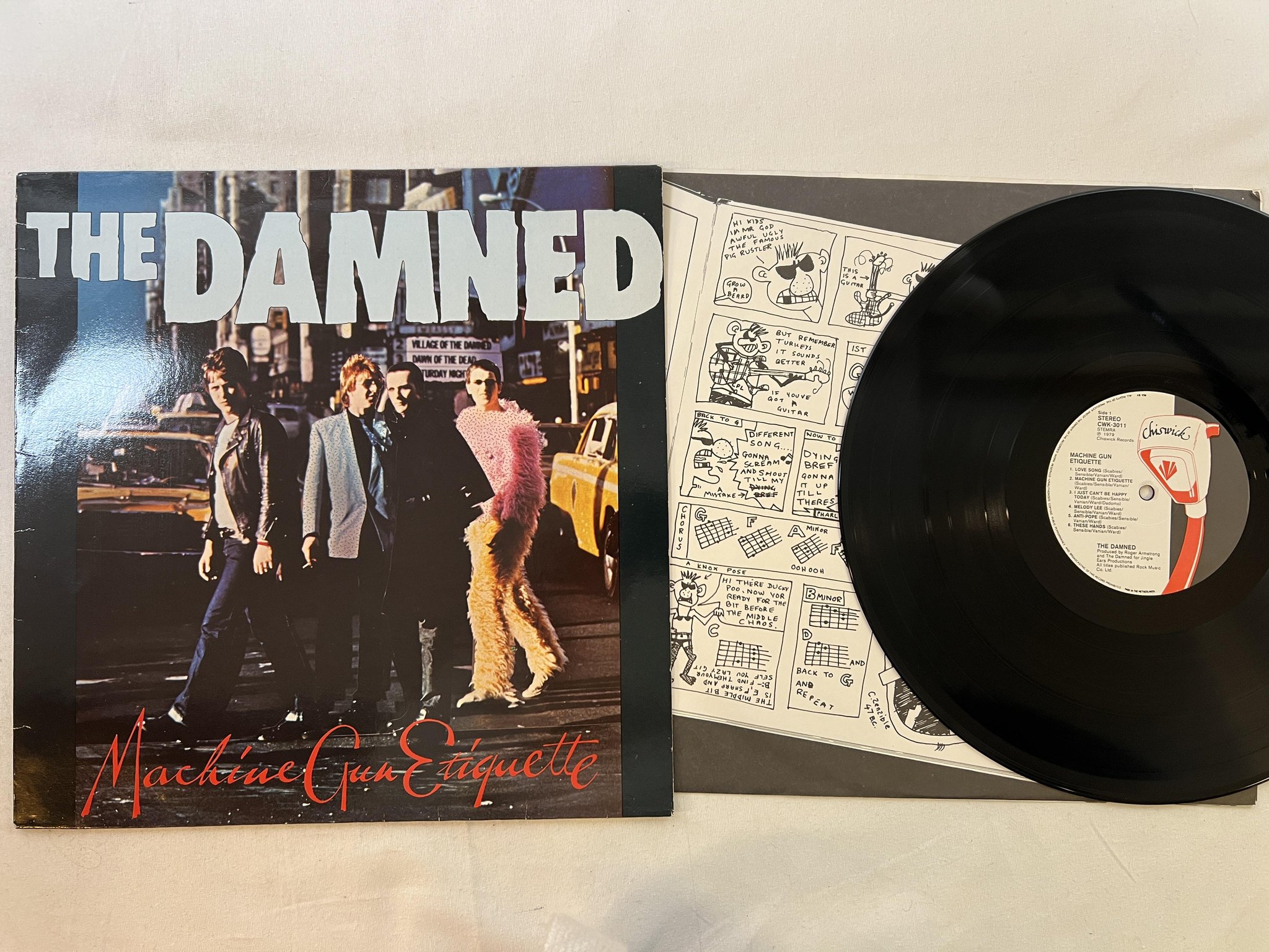 Omslagsbild för skivan THE DAMNED machine gun etiquette LP -79 Hol CHISWICK CWK-3011