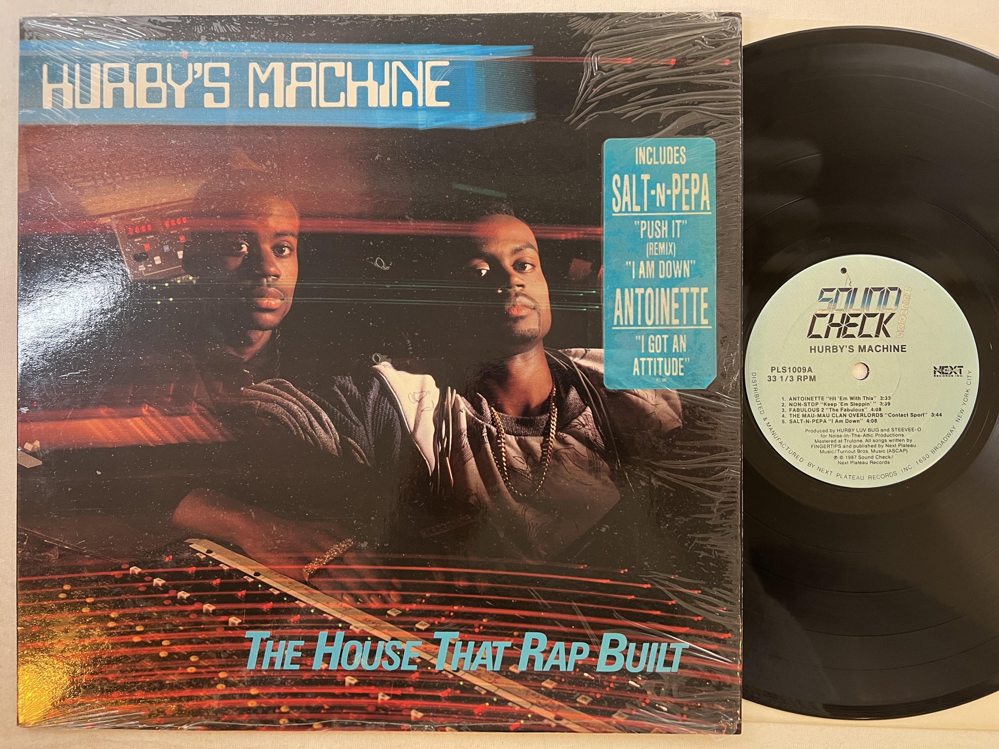 Omslagsbild för skivan HURBY'S MACHINE the house that rap built LP -87 US SOUND CHECK PLS 1009 hype