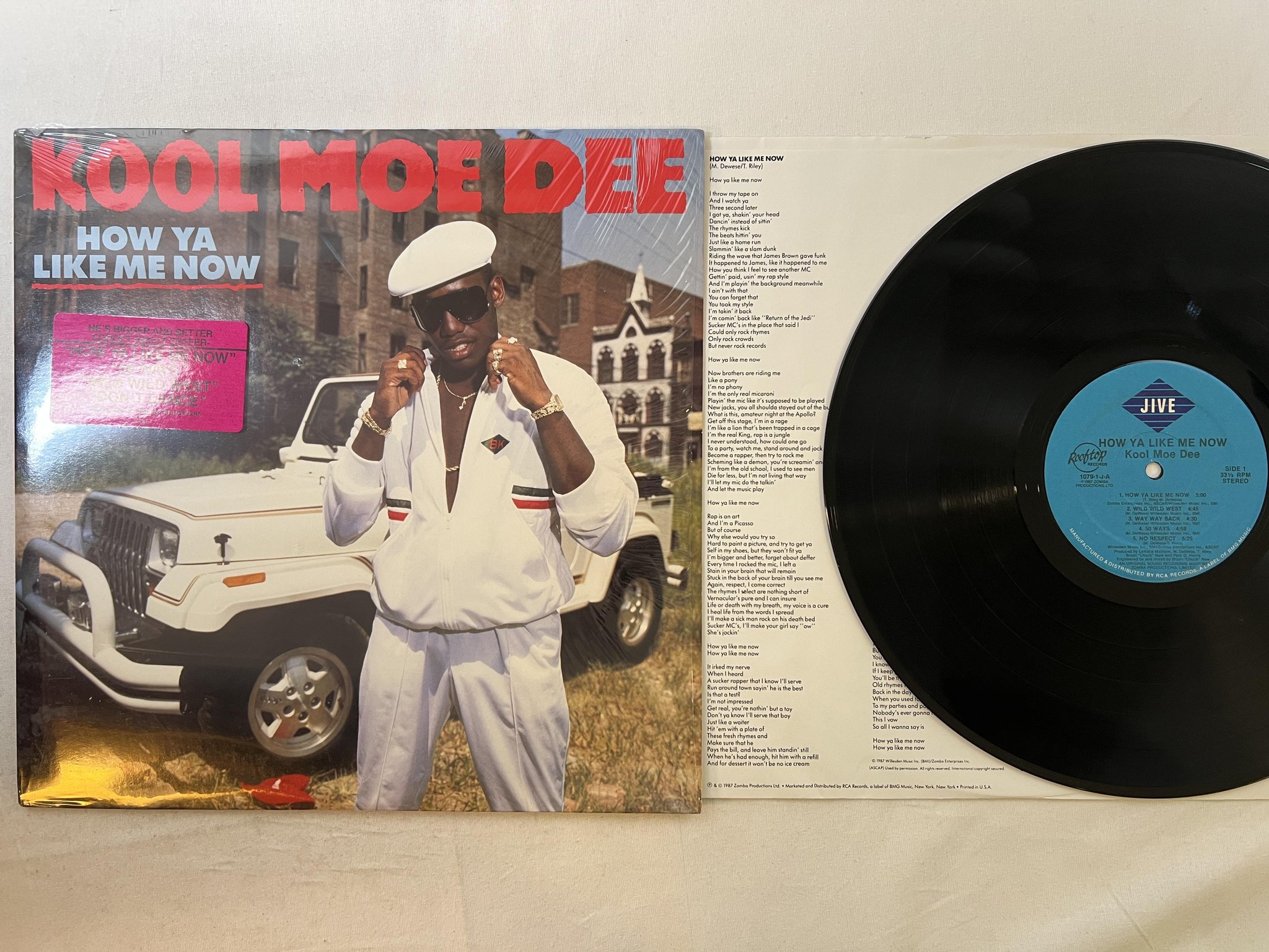 Omslagsbild för skivan KOOL MOE DEE how ya like me now LP -87 US JIVE 1079-1-J * hype sticker *