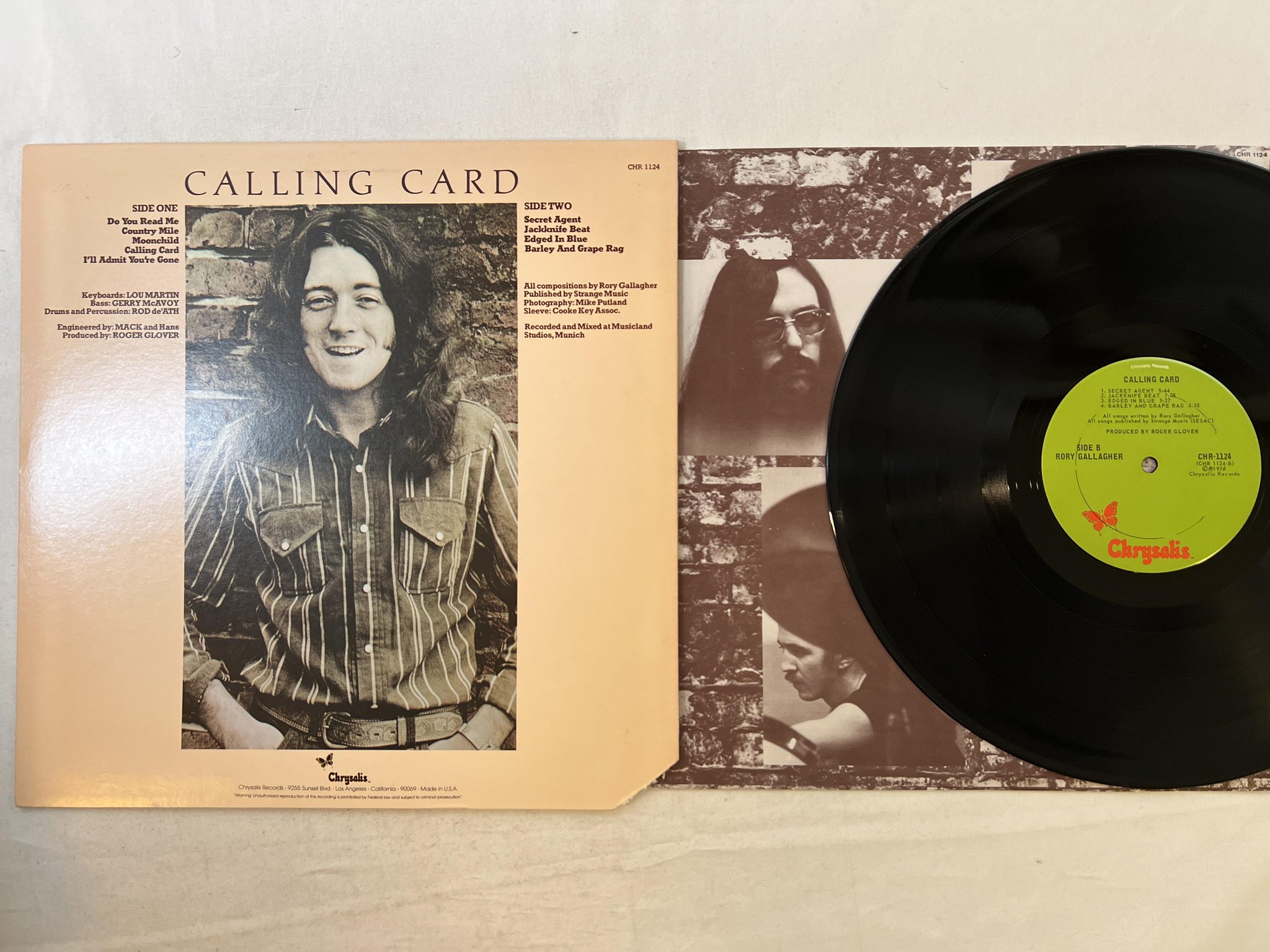 Omslagsbild för skivan RORY GALLAGHER calling card LP -76 US CHRYSALIS CHR 1124