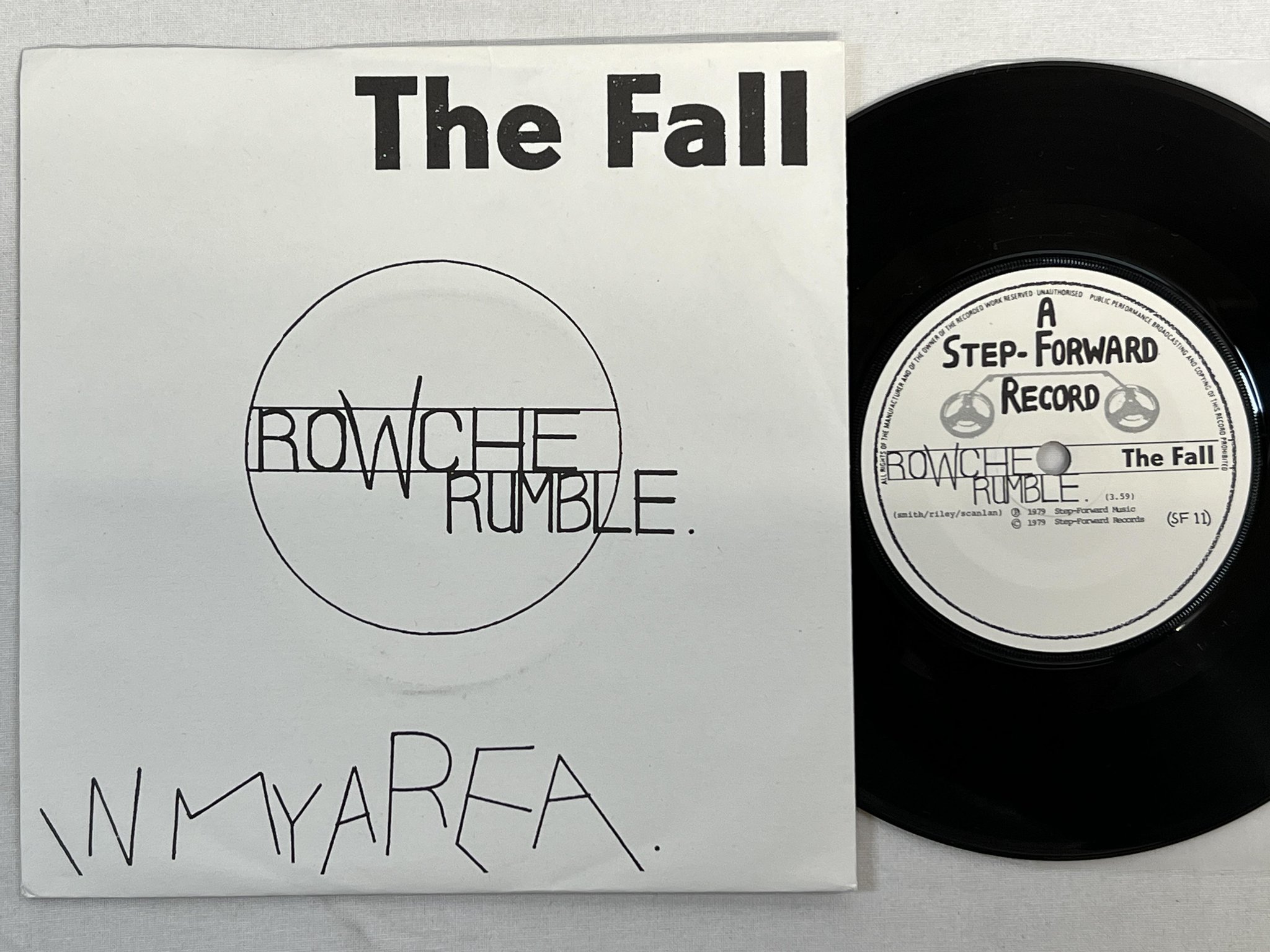 Omslagsbild för skivan THE FALL Rowche Rumble 7" -79 UK step-forward SF 11 ** new wave / punk **