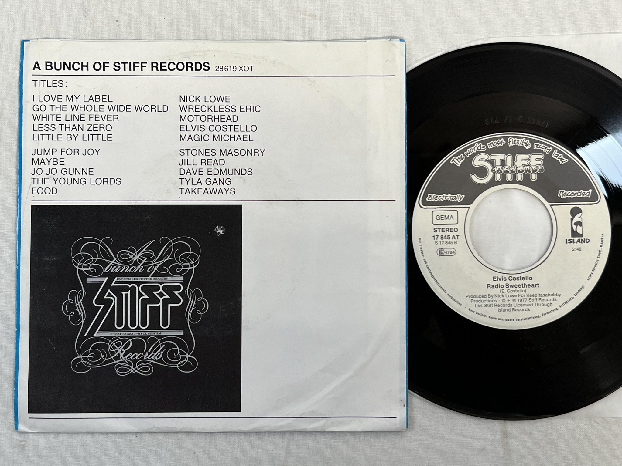 Omslagsbild för skivan ELVIS COSTELLO Less Than Zero 7" -77 Ger STIFF 17 845 AT