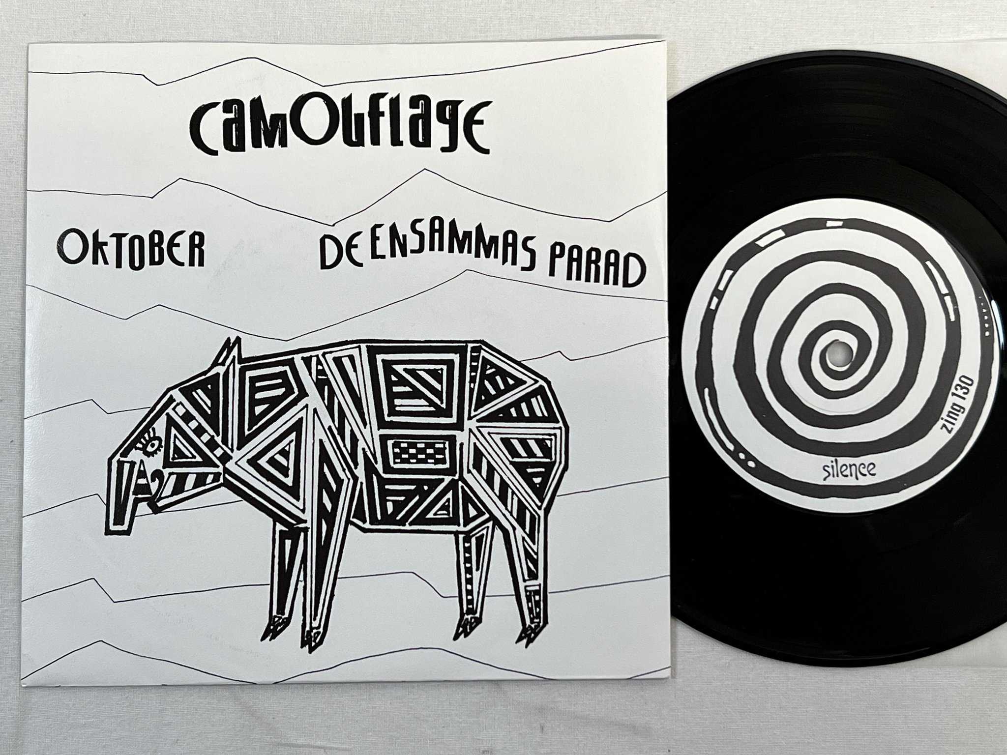 Omslagsbild för skivan CAMOUFLAGE Oktober 7" -86 Swe SILENCE ZING 130 NEW WAVE