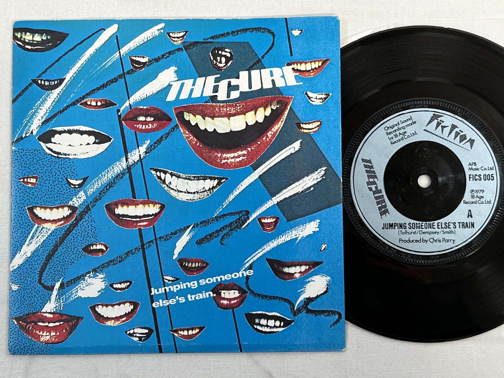 Omslagsbild för skivan THE CURE Jumping Someone Else's Train 7" -79 UK FICTION FICS 005