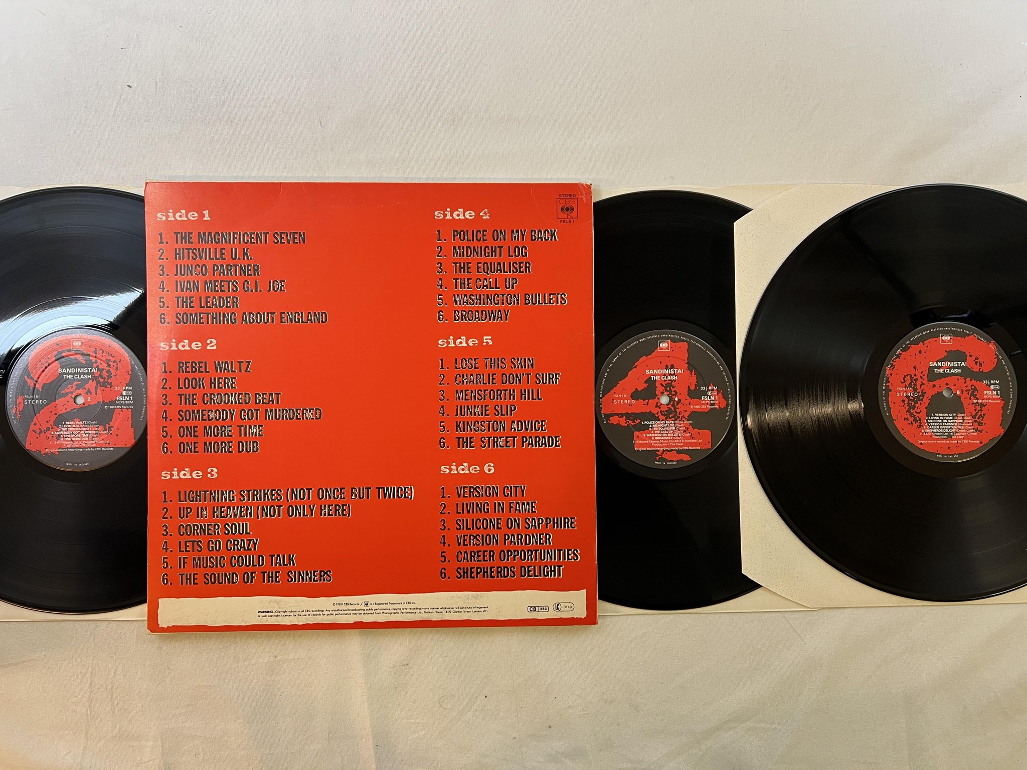 Omslagsbild för skivan THE CLASH sandinista! 3xLP -80 UK CBS FSLN 1