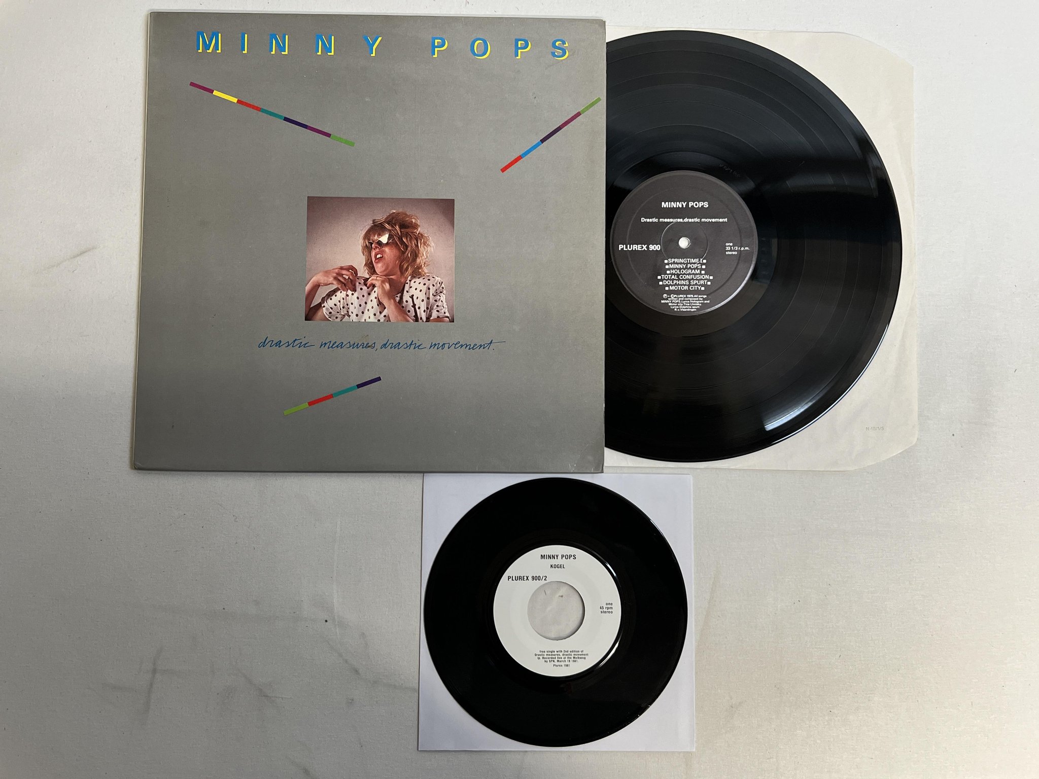 Omslagsbild för skivan MINNY POPS drastic measures drastic Movement LP + 45 -81 Hol PLUREX 900