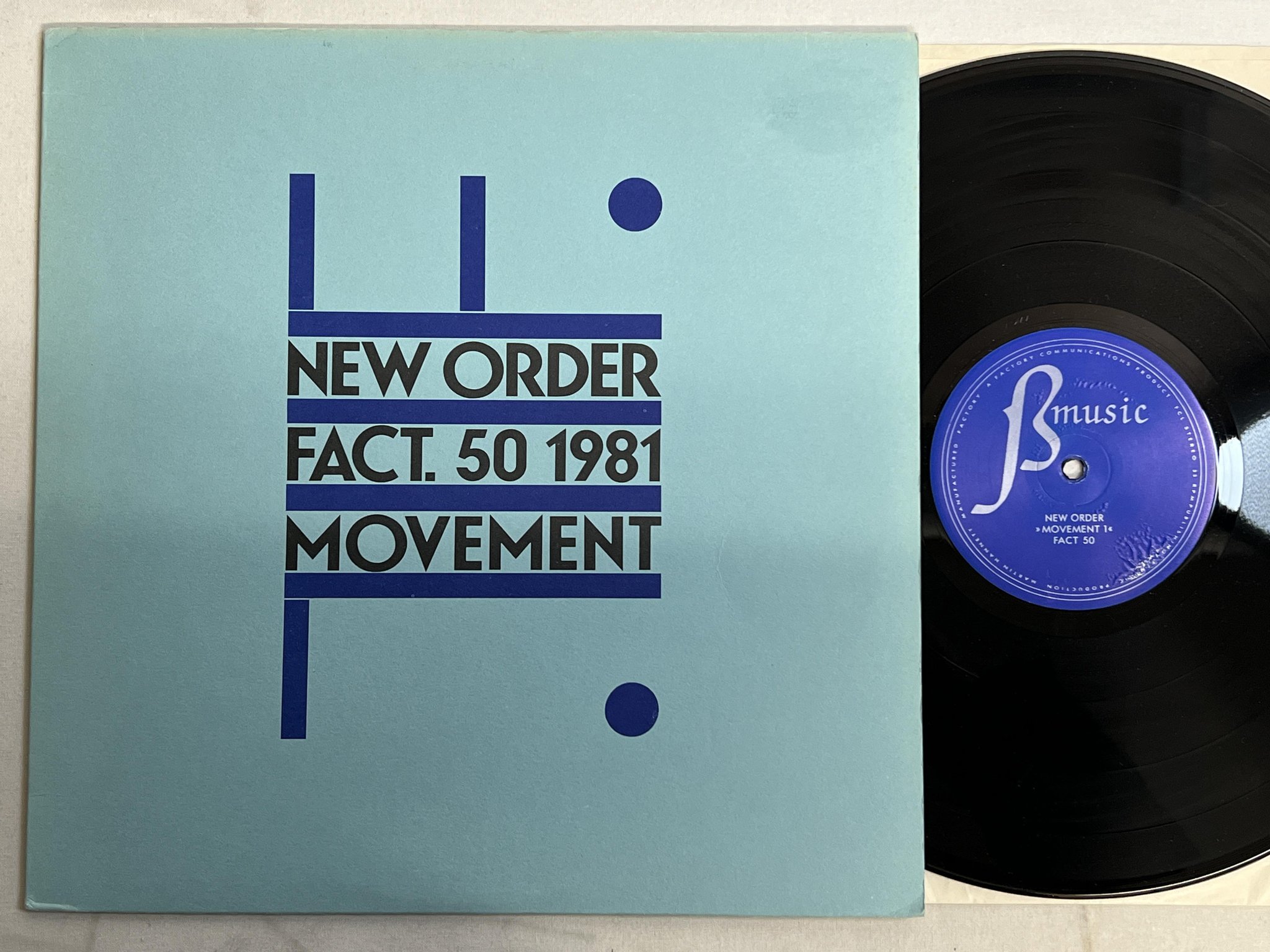 Omslagsbild för skivan NEW ORDER movement 1 LP -85 UK FACTORY FAC. 33 **A5 Pressing**