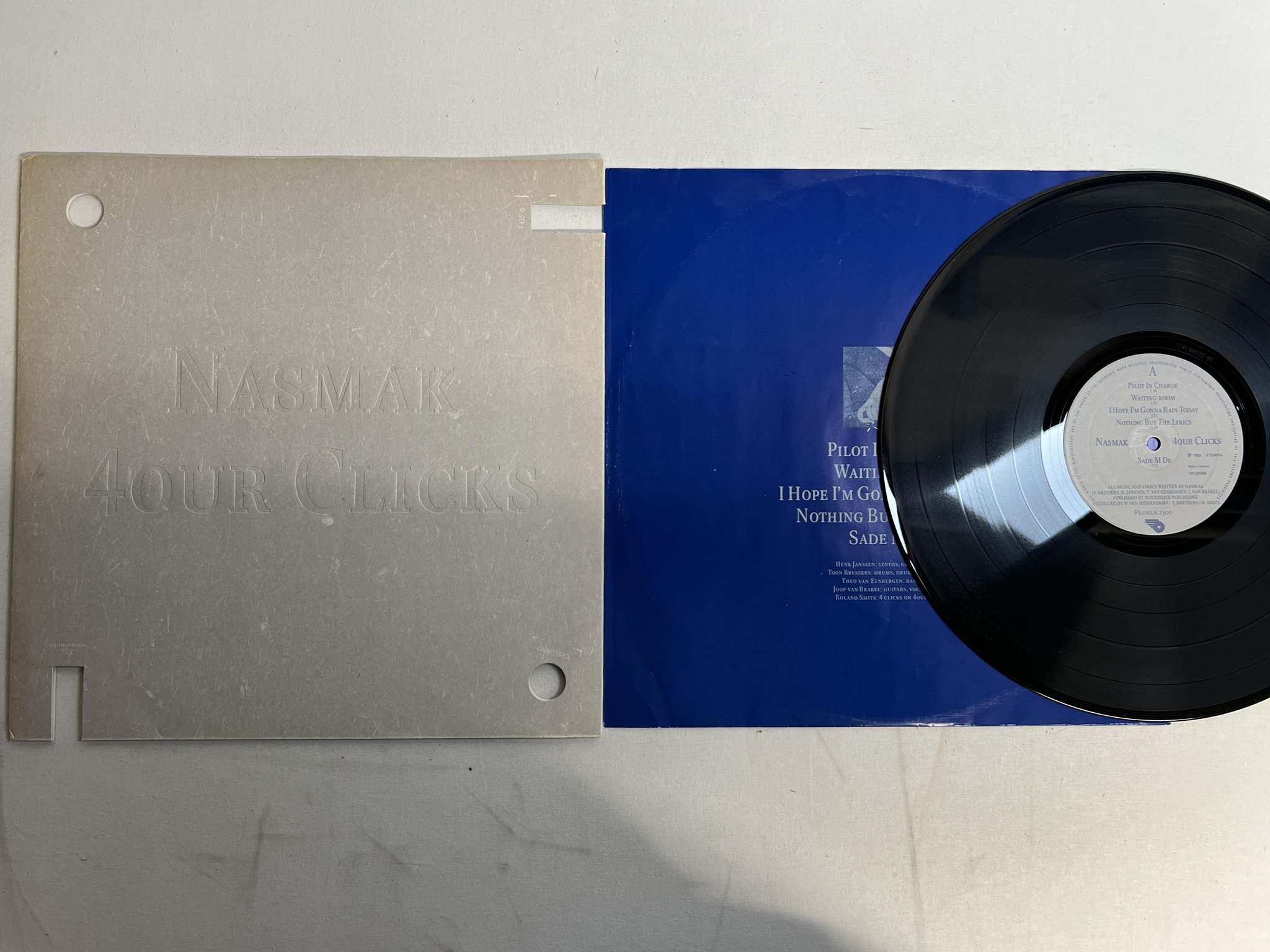 Omslagsbild för skivan NASMAK 4our Clicks LP -82 Hol PLUREX 2300