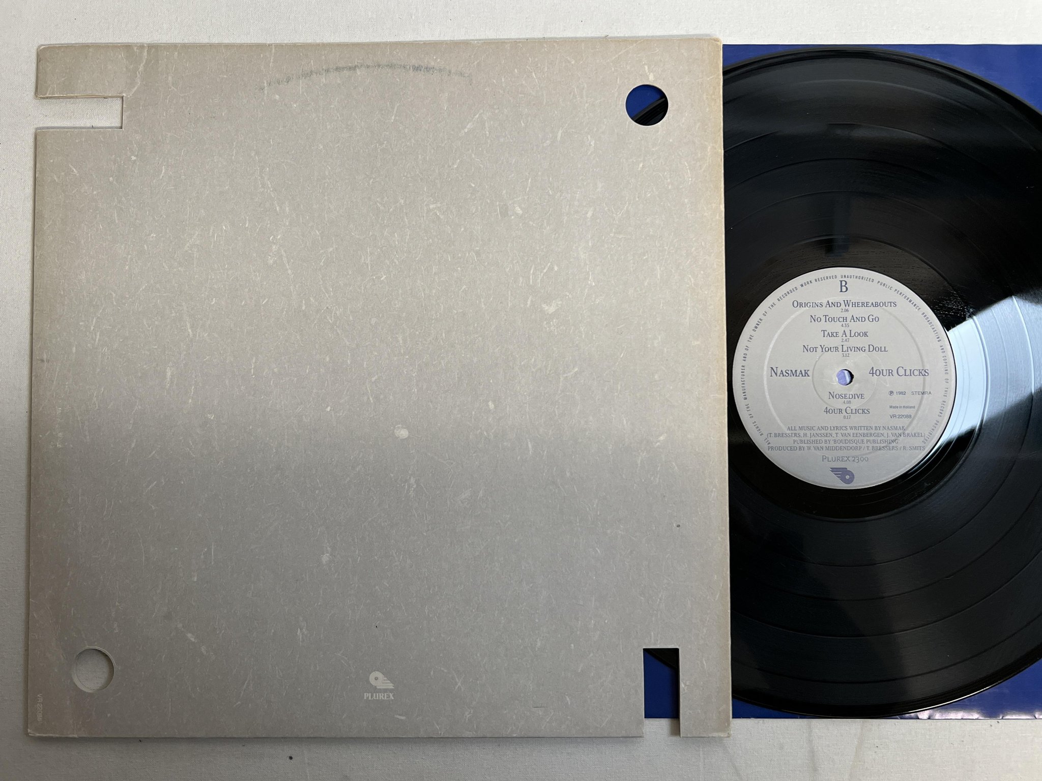Omslagsbild för skivan NASMAK 4our Clicks LP -82 Hol PLUREX 2300