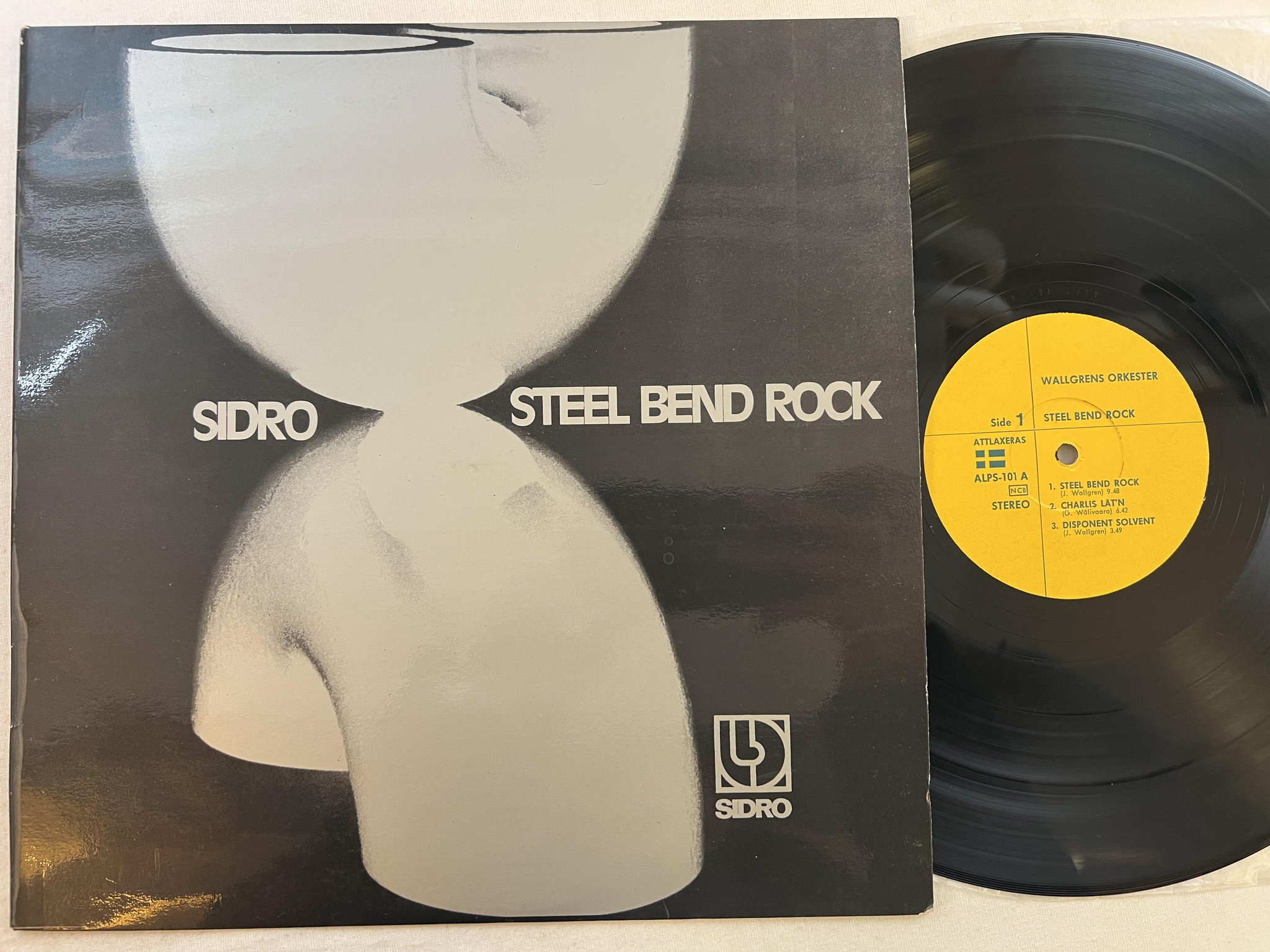 Omslagsbild för skivan WALLGRENS ORKESTER steel bend rock LP -73 Swe ATTLAXERAS ALPS-101