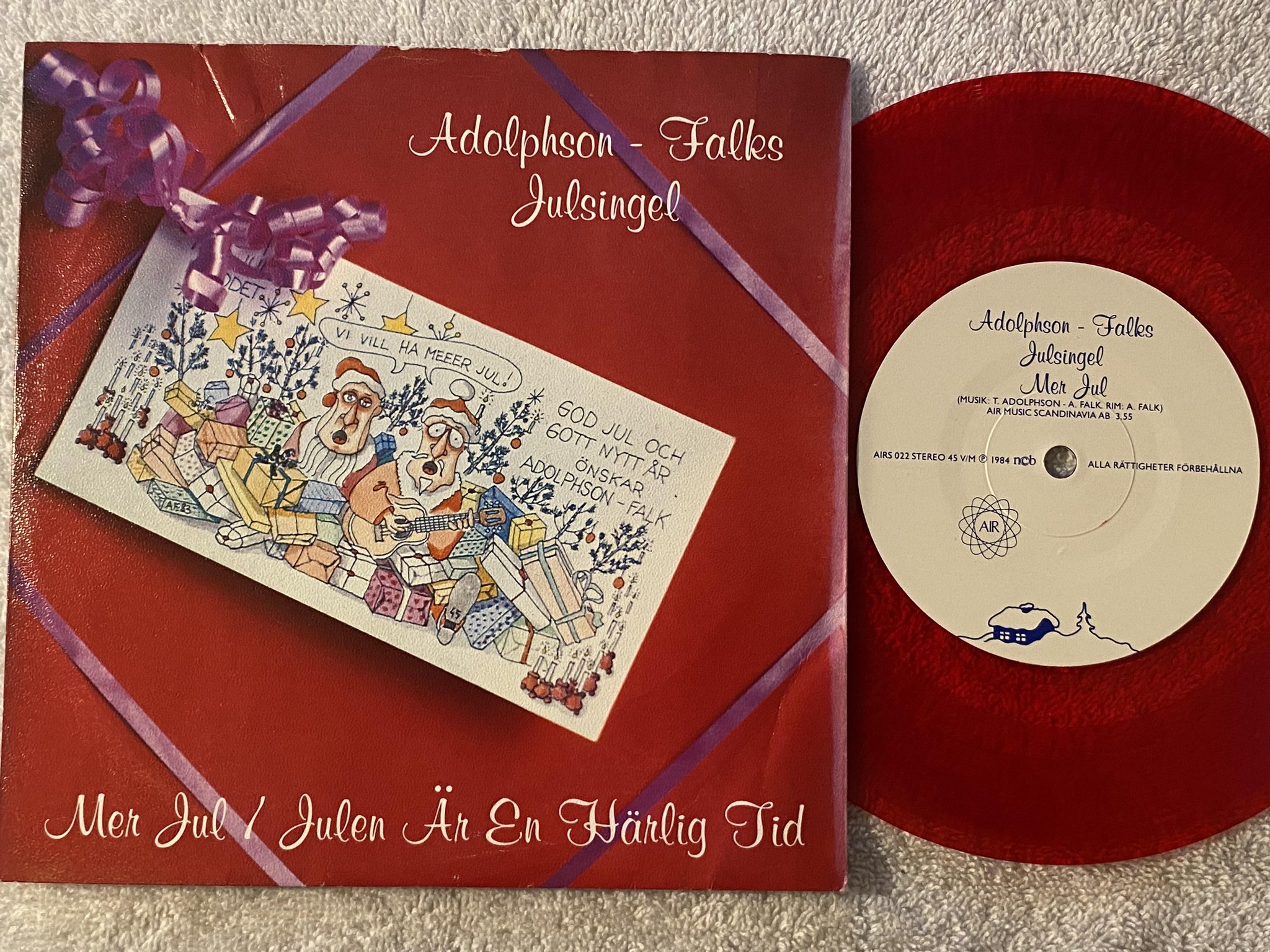 Omslagsbild för skivan ADOLPHSON - FALKS mer jul 7"single -84 ncb AIRS 022 ** red vinyl **