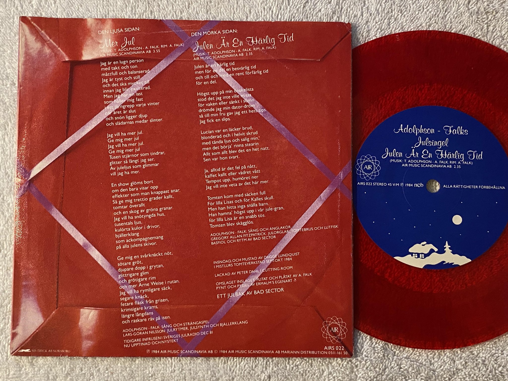 Omslagsbild för skivan ADOLPHSON - FALKS mer jul 7"single -84 ncb AIRS 022 ** red vinyl **