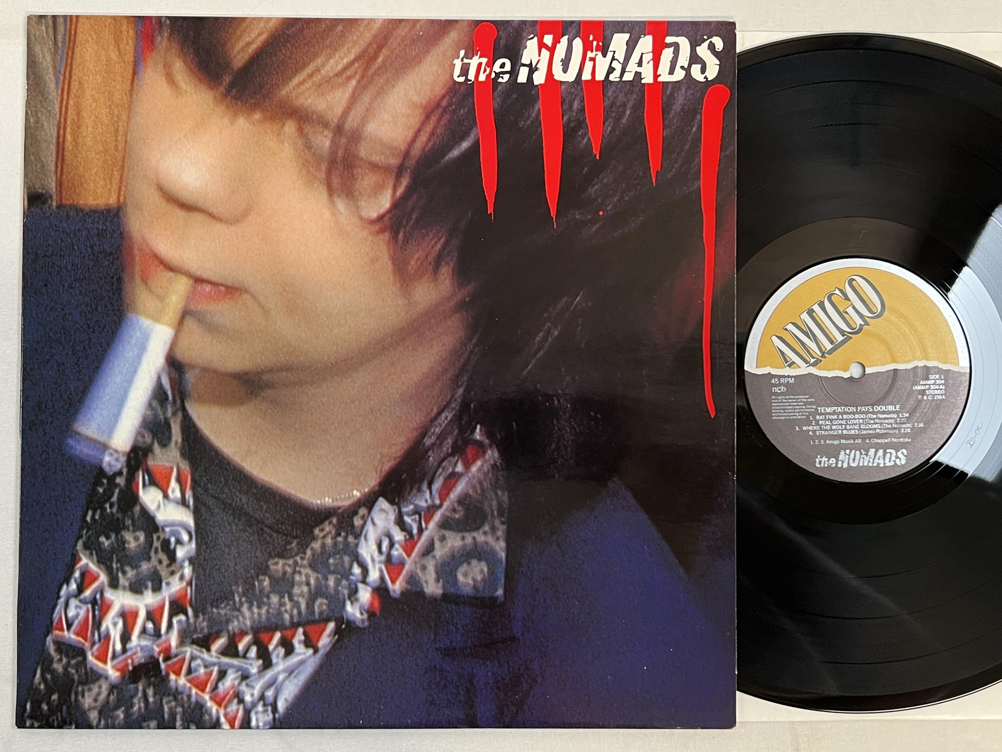 Omslagsbild för skivan THE NOMADS temptation pays double LP -84 Swe AMIGO AMMP 302
