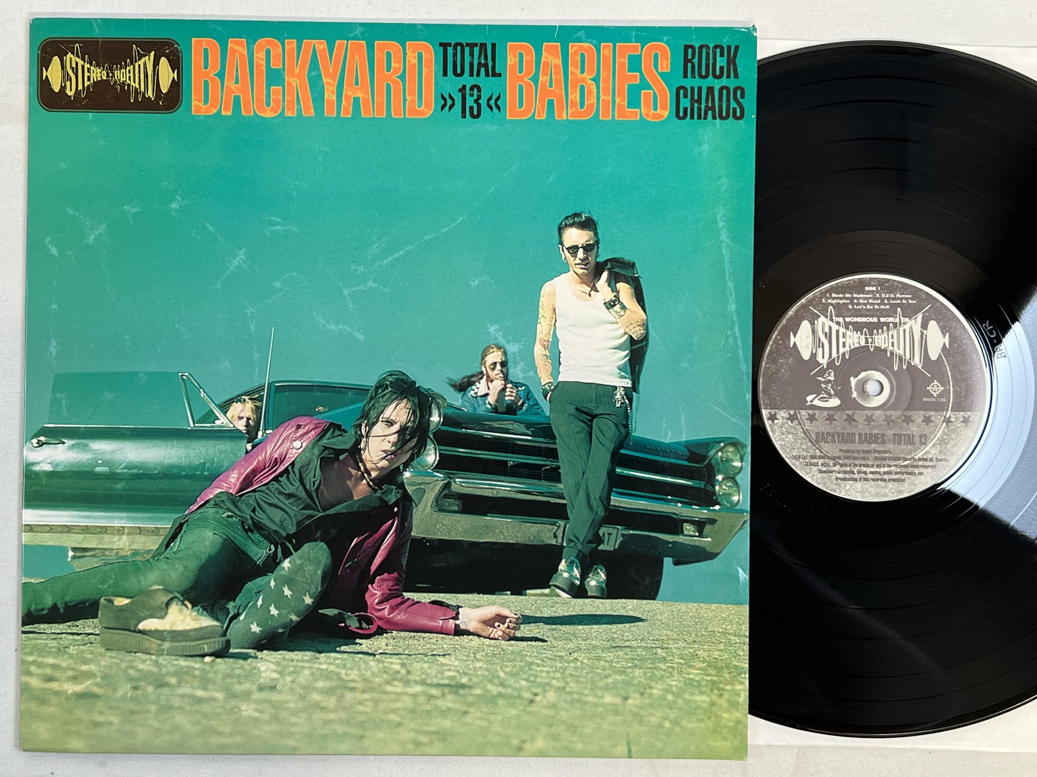 Omslagsbild för skivan THE BACKYARD BABIES total 13 LP -98 Swe MVG MVGV 135 *** YEAH ***