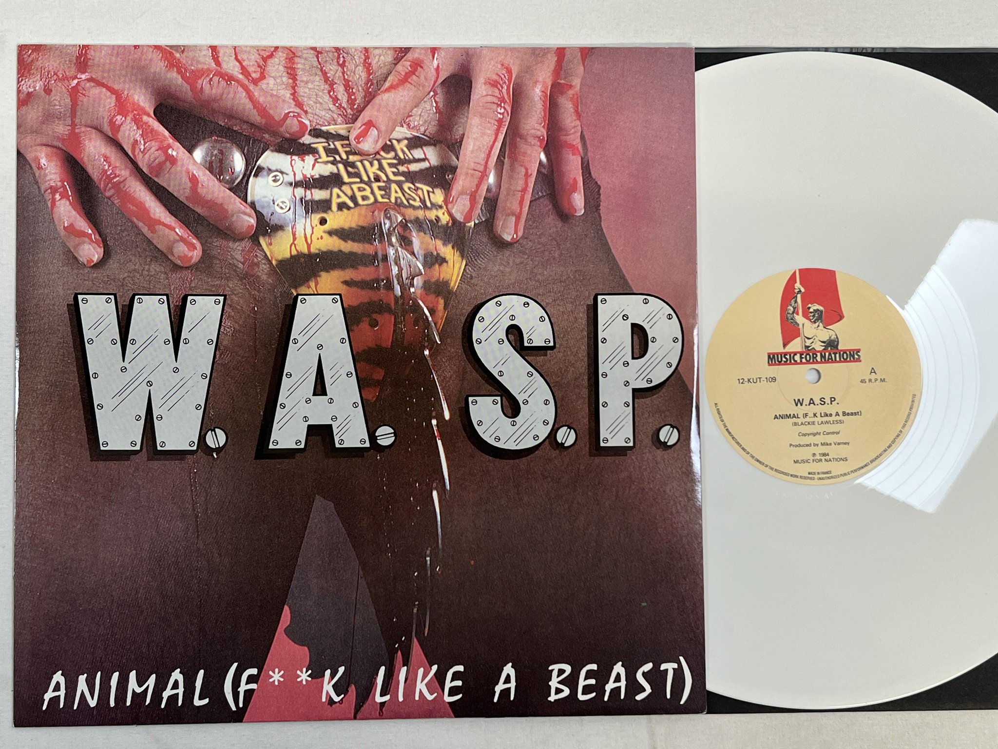 Omslagsbild för skivan W.A.S.P. animal 12"single -84 MUSIC FOR NATIONS 12-KUT-109 ** WHITE VINYL **