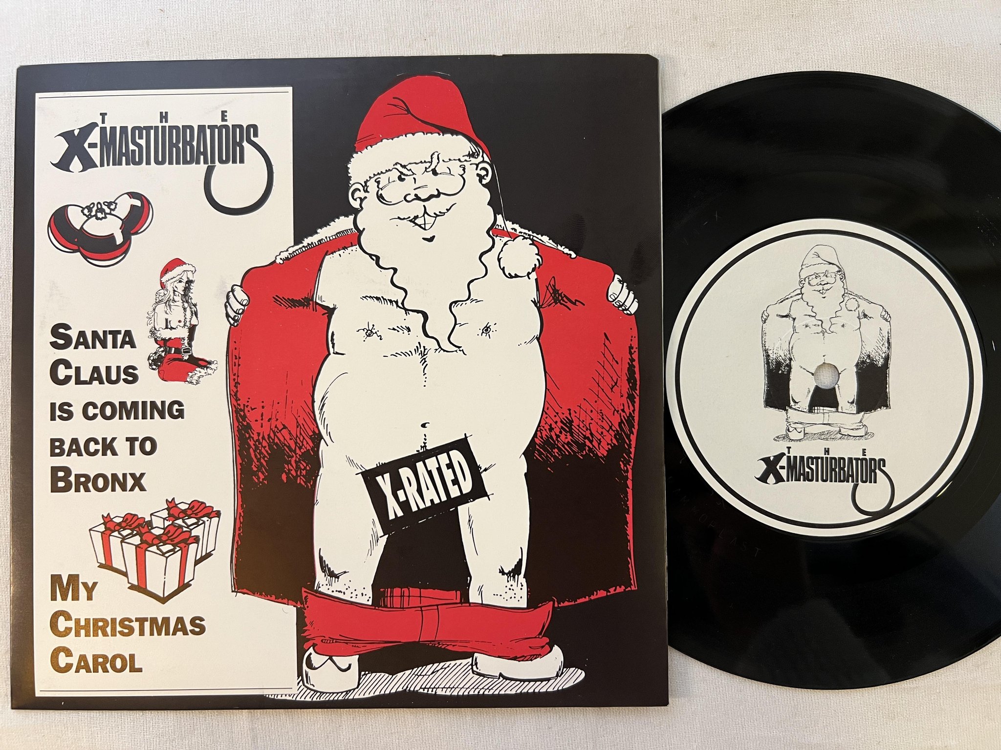 Omslagsbild för skivan X-MASTURBATORS Santa Claus is coming back to Bronx 7" -89 Swe X-MAS 002-X