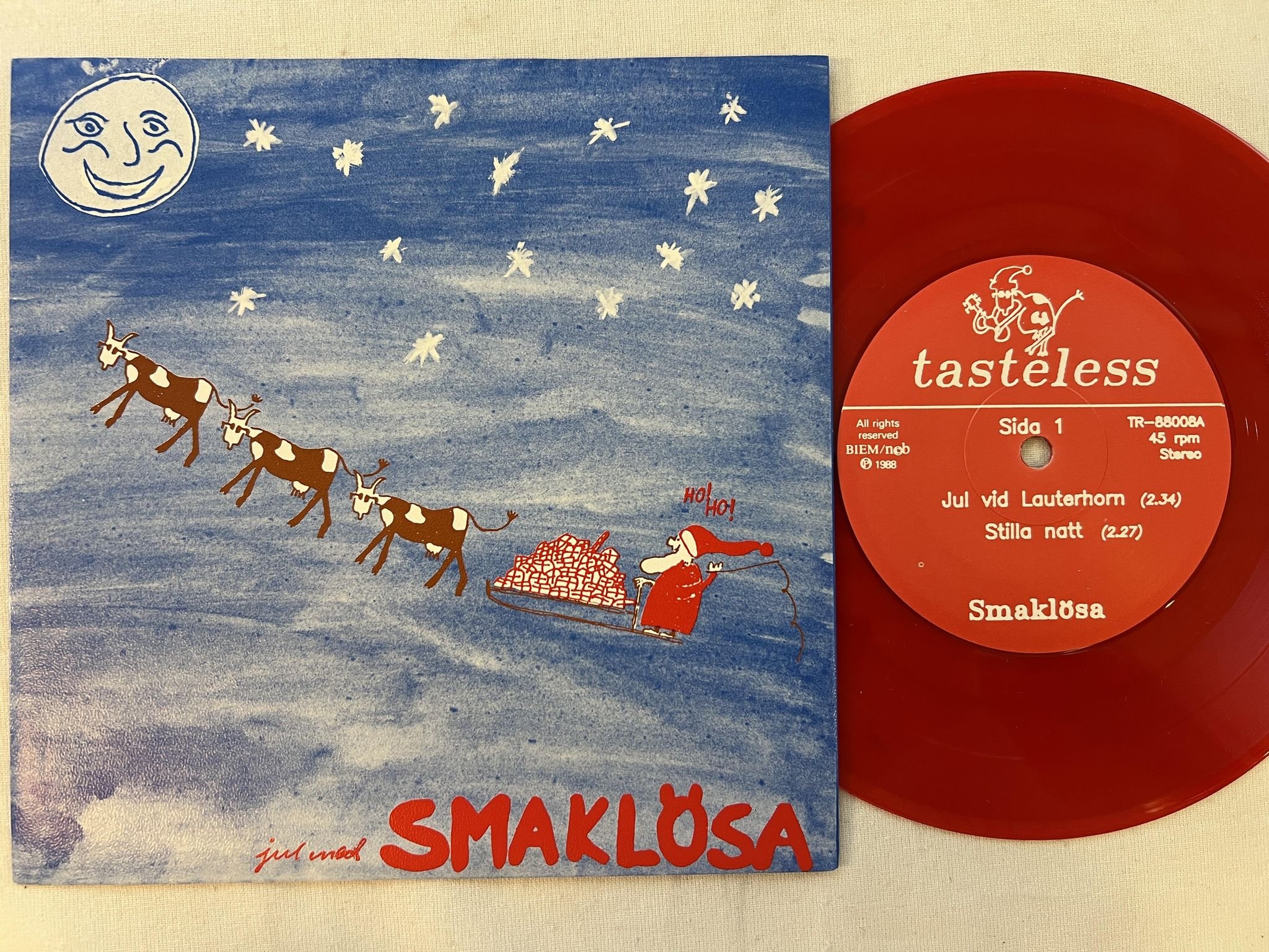 Omslagsbild för skivan SMAKLÖSA Jul Med Smaklösa 7"single -88 Swe TASTELESS TE-88008 ** RED VINYL **