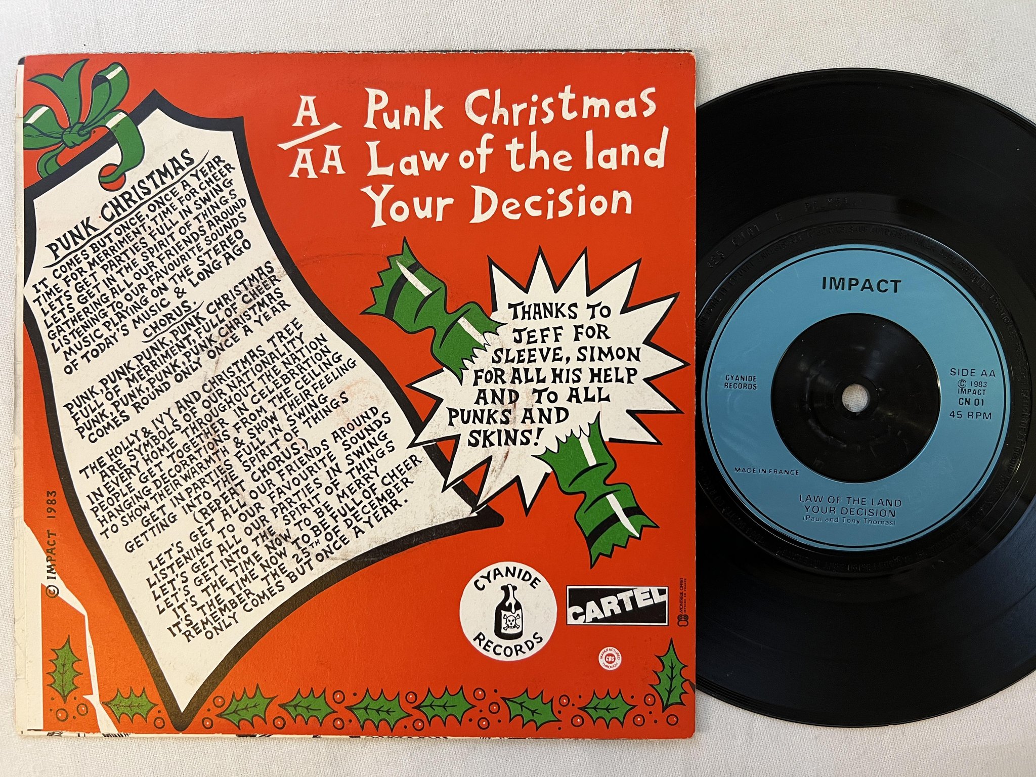 Omslagsbild för skivan IMPACT punk christmas 7"single -83 CYANIDE CN 01
