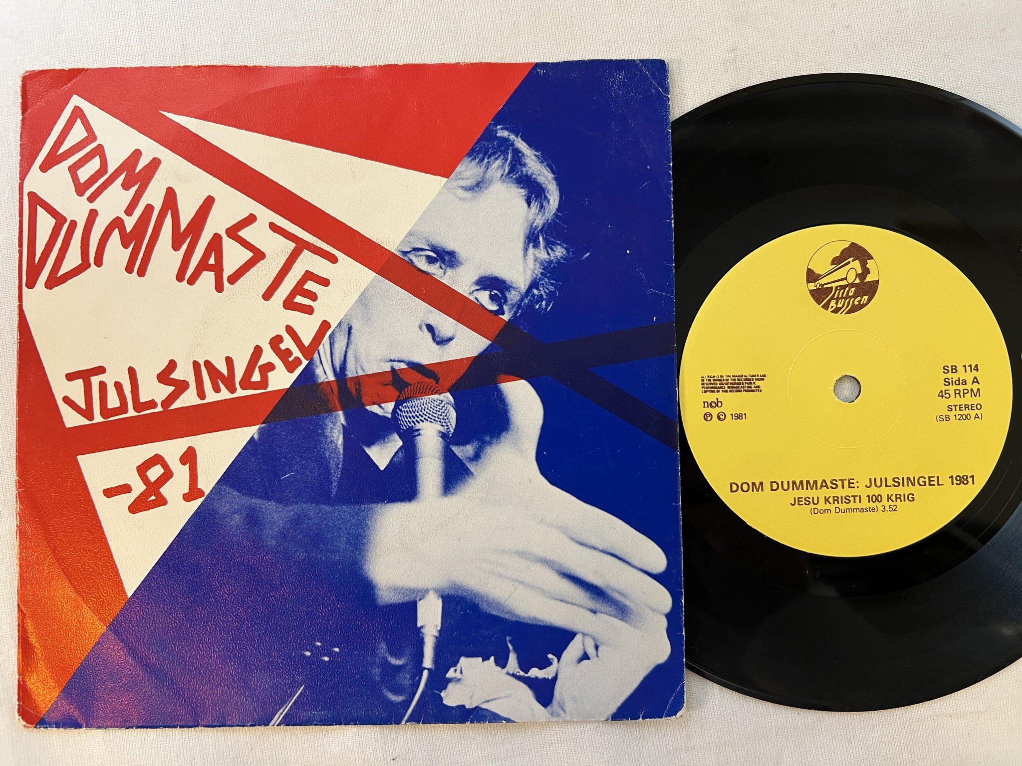 Omslagsbild för skivan DOM DUMMASTE julsingel 1981 7"single -81 SISTA BUSSEN SB 114