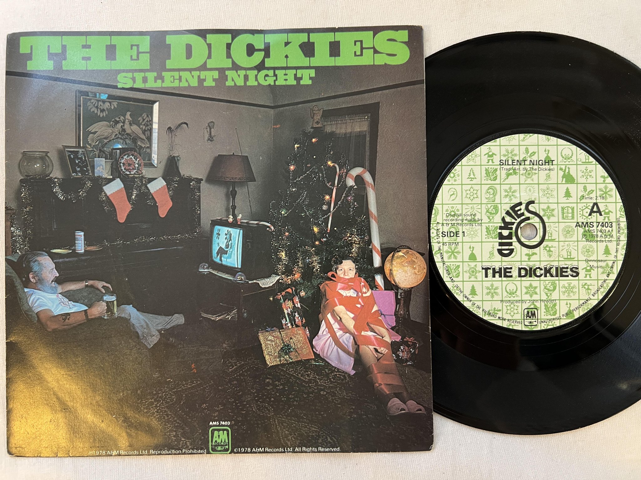 Omslagsbild för skivan THE DICKIES silent night 7"single -78 UK A6M AMS 7403