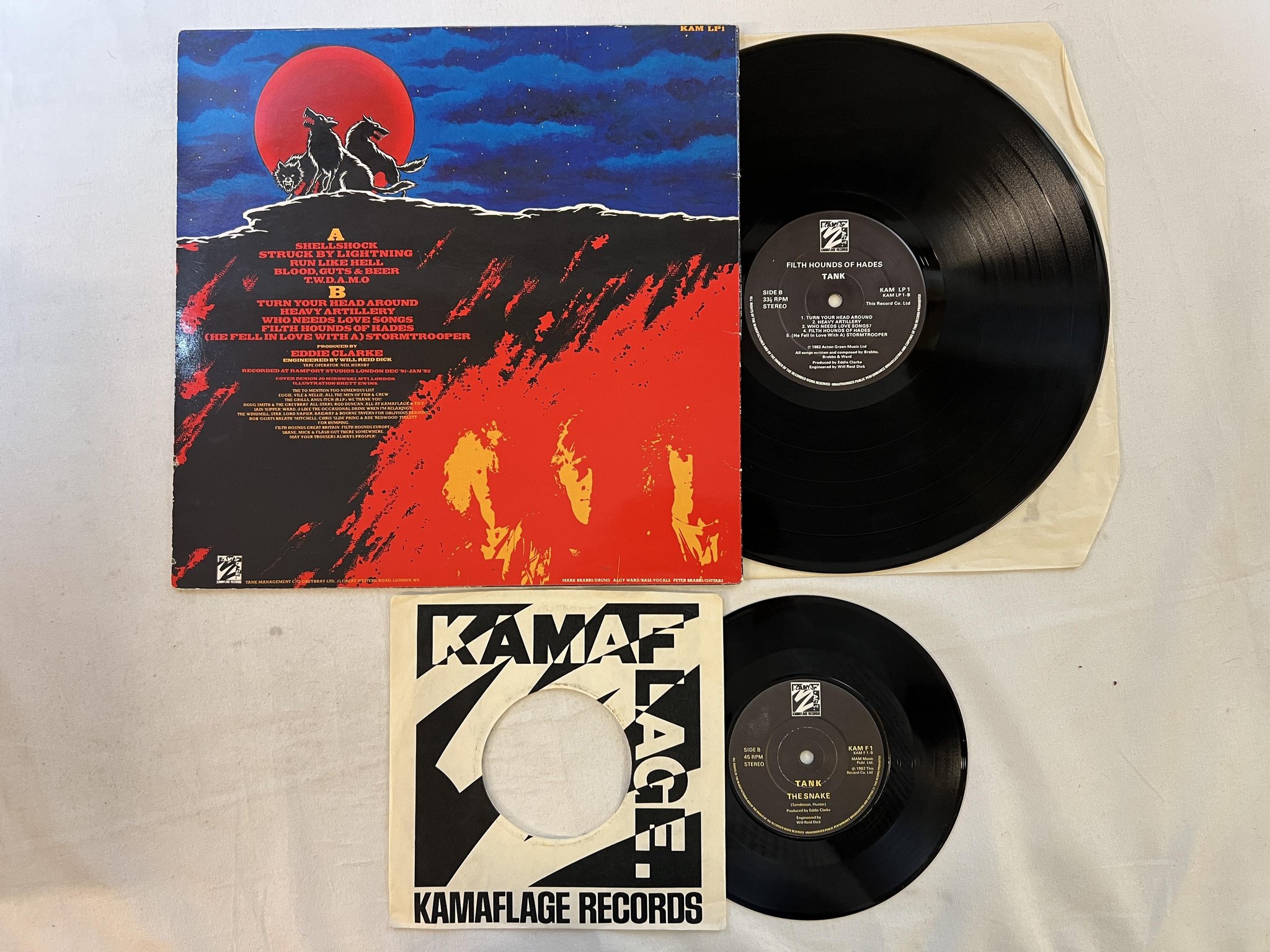 Omslagsbild för skivan TANK filth hounds of hades LP + 7"single -82 UK KAMAFLAGE KAM LP1
