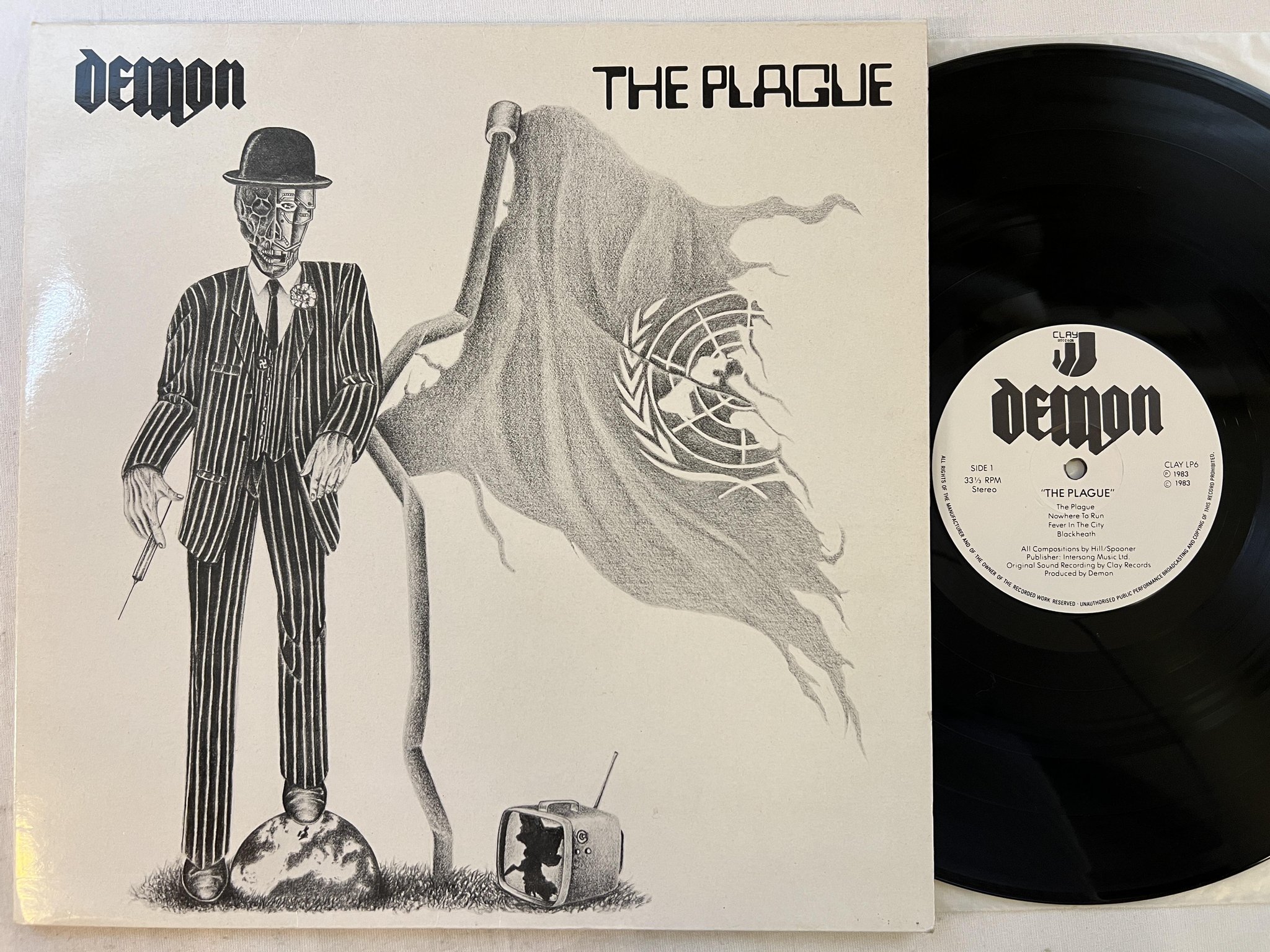Omslagsbild för skivan DEMON the plague LP -83 UK CLAY LP6