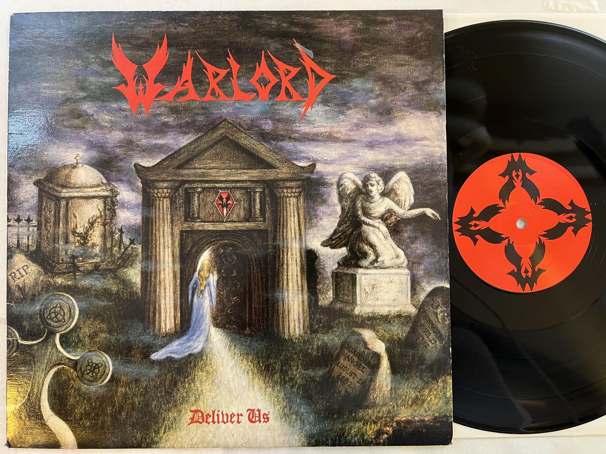 Omslagsbild för skivan WARLORD deliver us LP -83 METAL BLADE MBR 1005 *** RARE HEAVY METAL ***