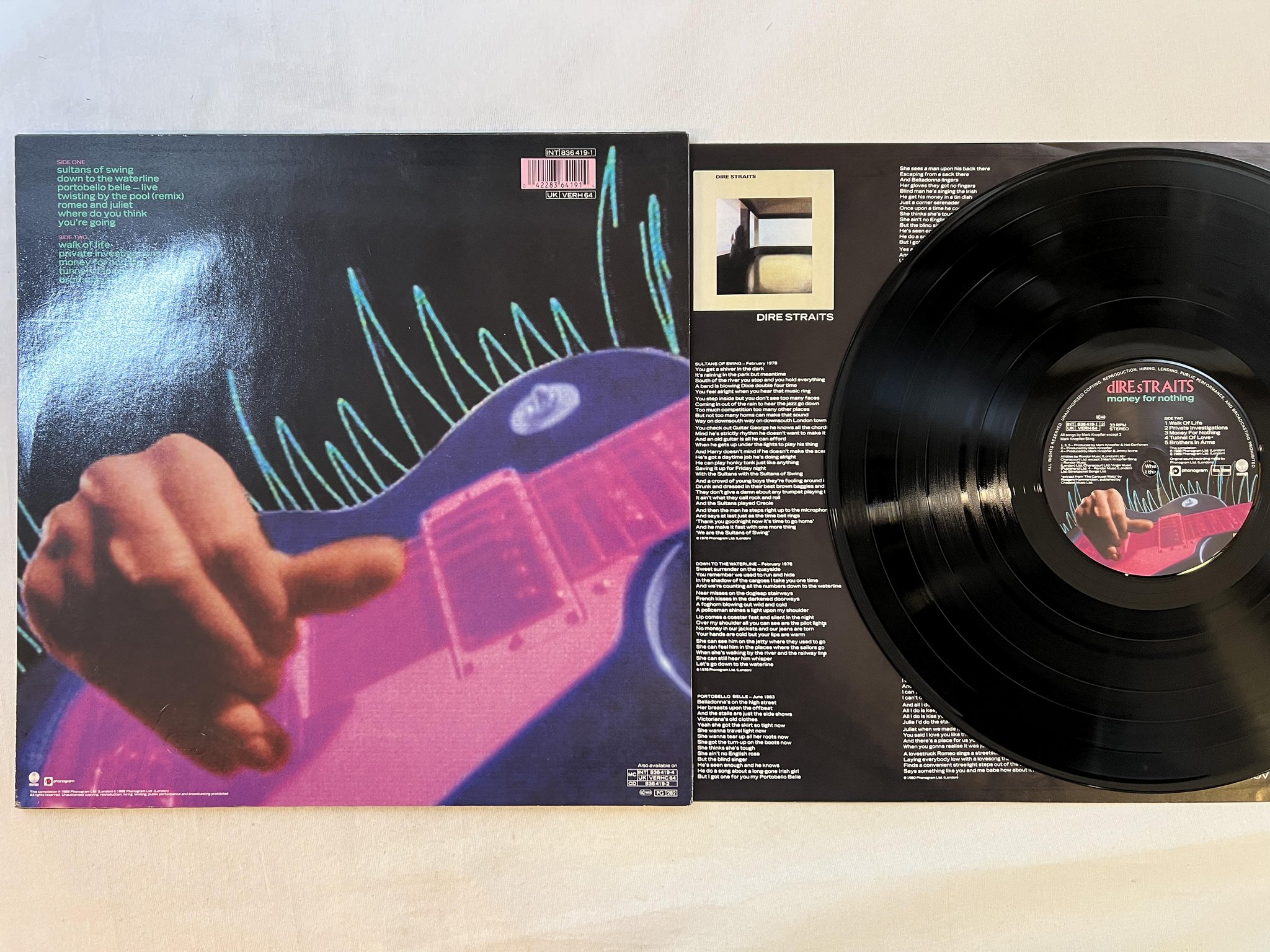 Omslagsbild för skivan DIRE STRAITS money for nothing LP -88 Hol VERTIGO 836419-1