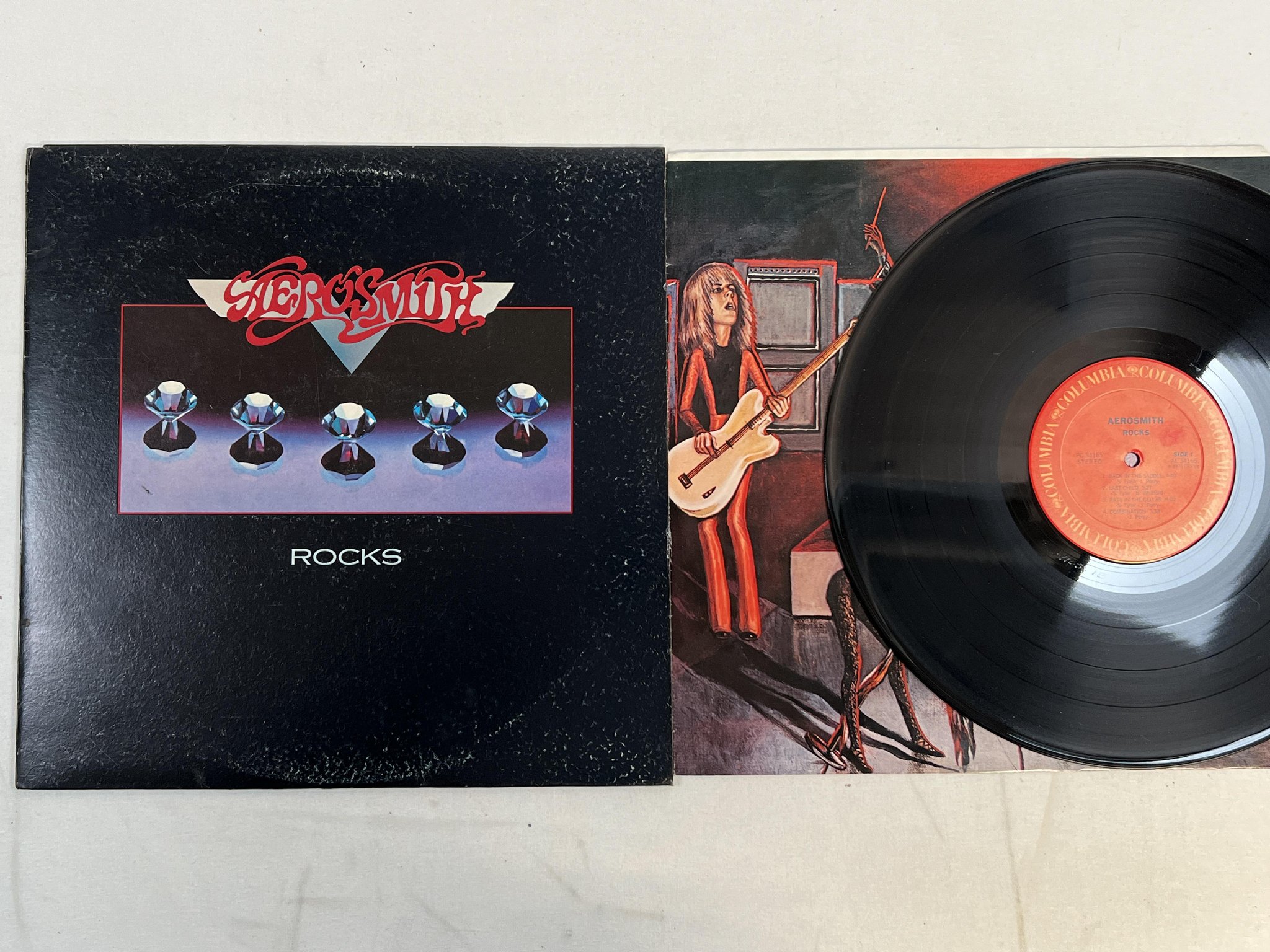 Omslagsbild för skivan AEROSMITH rocks LP -76 US COLUMBIA PC 34165