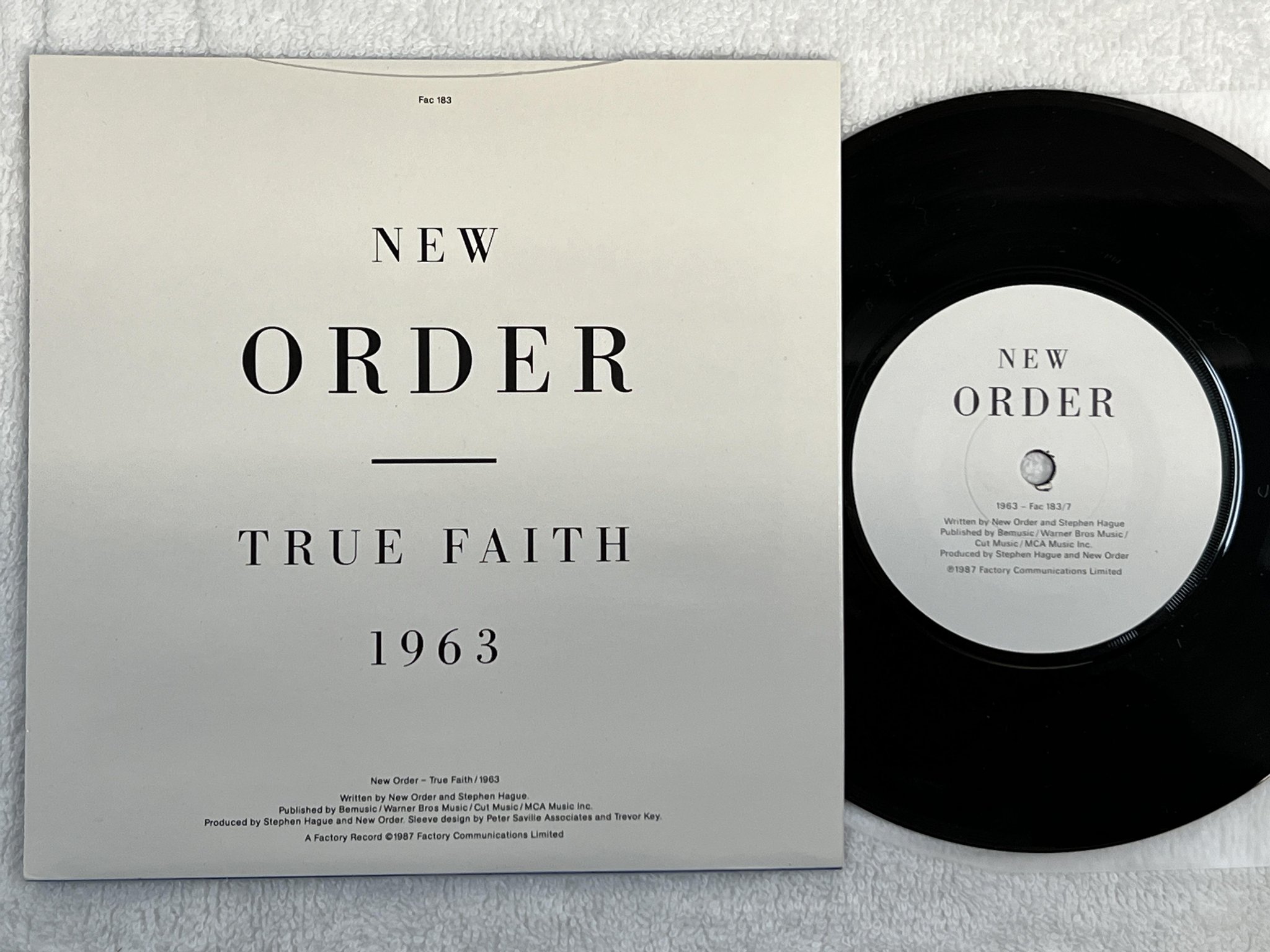 Omslagsbild för skivan NEW ORDER true faith 7" -87 FACTORY FAC 183/7