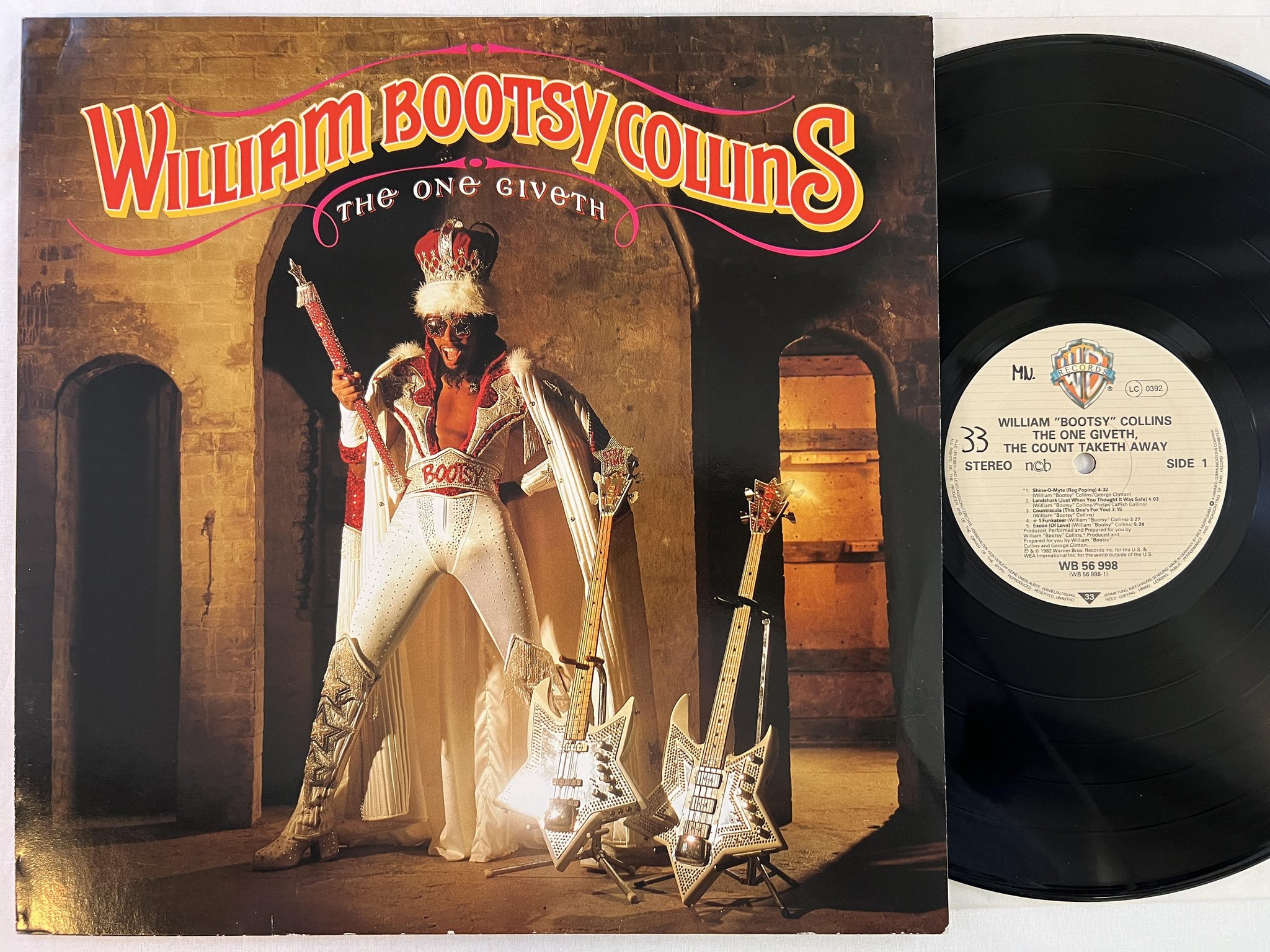 Omslagsbild för skivan WILLIAM BOOTSY COLLINS the one giveth LP -82 ncb WARNER WB 56 998 ** funk **