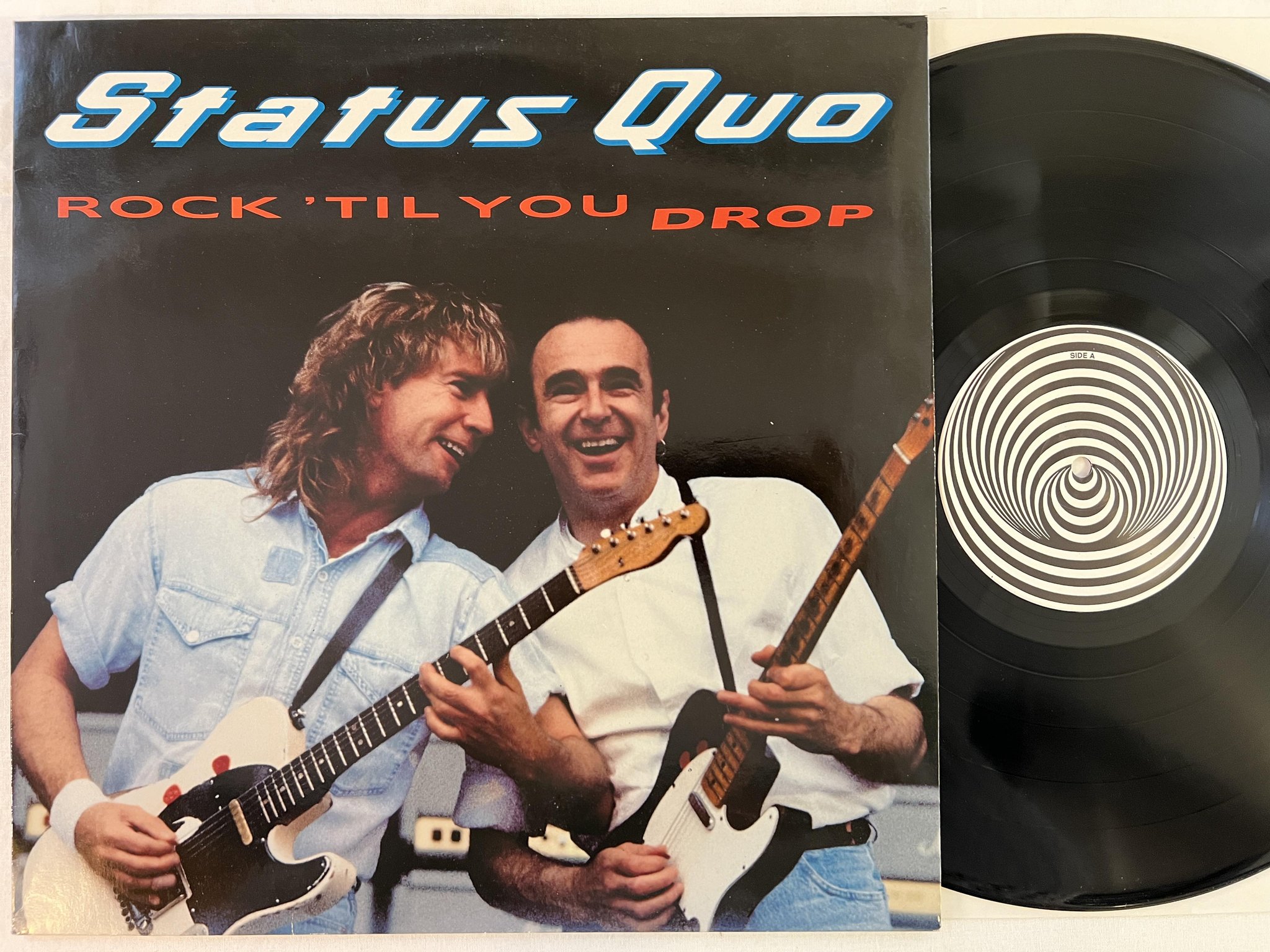 Omslagsbild för skivan STATUS QUO Rock 'Til You Drop LP -91 vertigo 510 341-1
