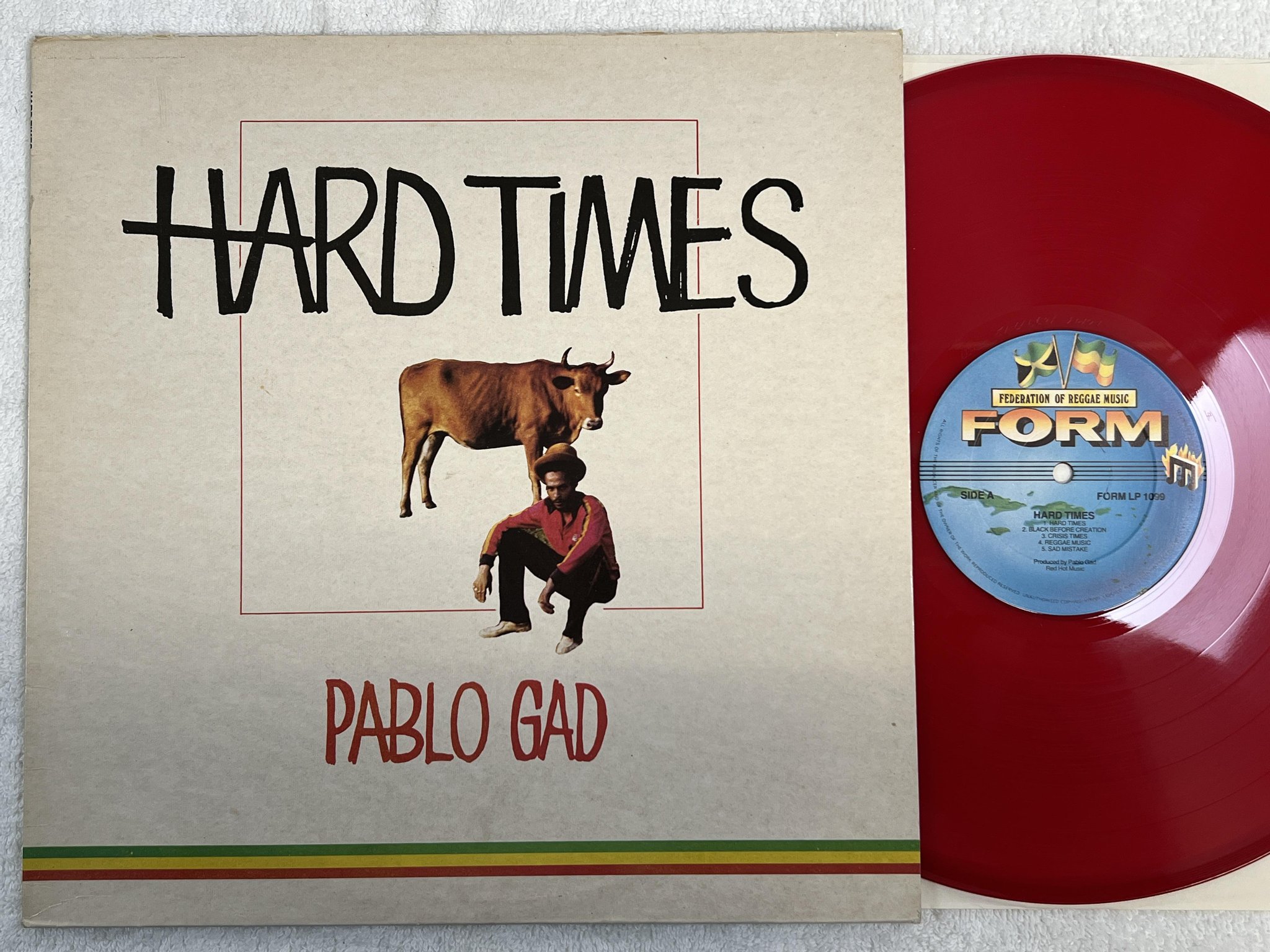 Omslagsbild för skivan PABLO GAD hard times LP -80 UK FORM LP 1099 ** RED VINYL **